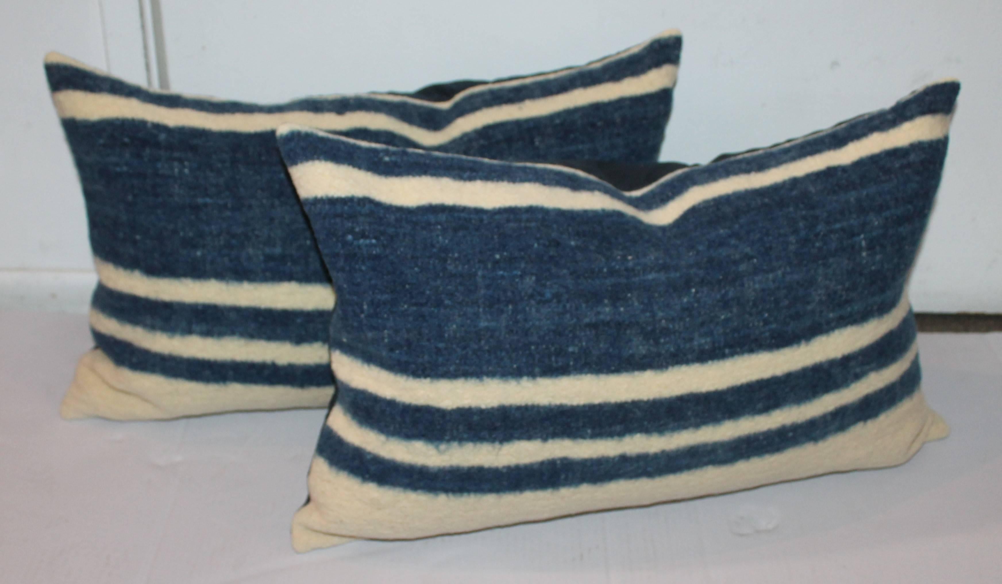 These hand woven Mexican weaving bolster pillows are in great condition. Sold in pairs. The backings are in blue cotton linen. Sold as a group collection of four pillows.