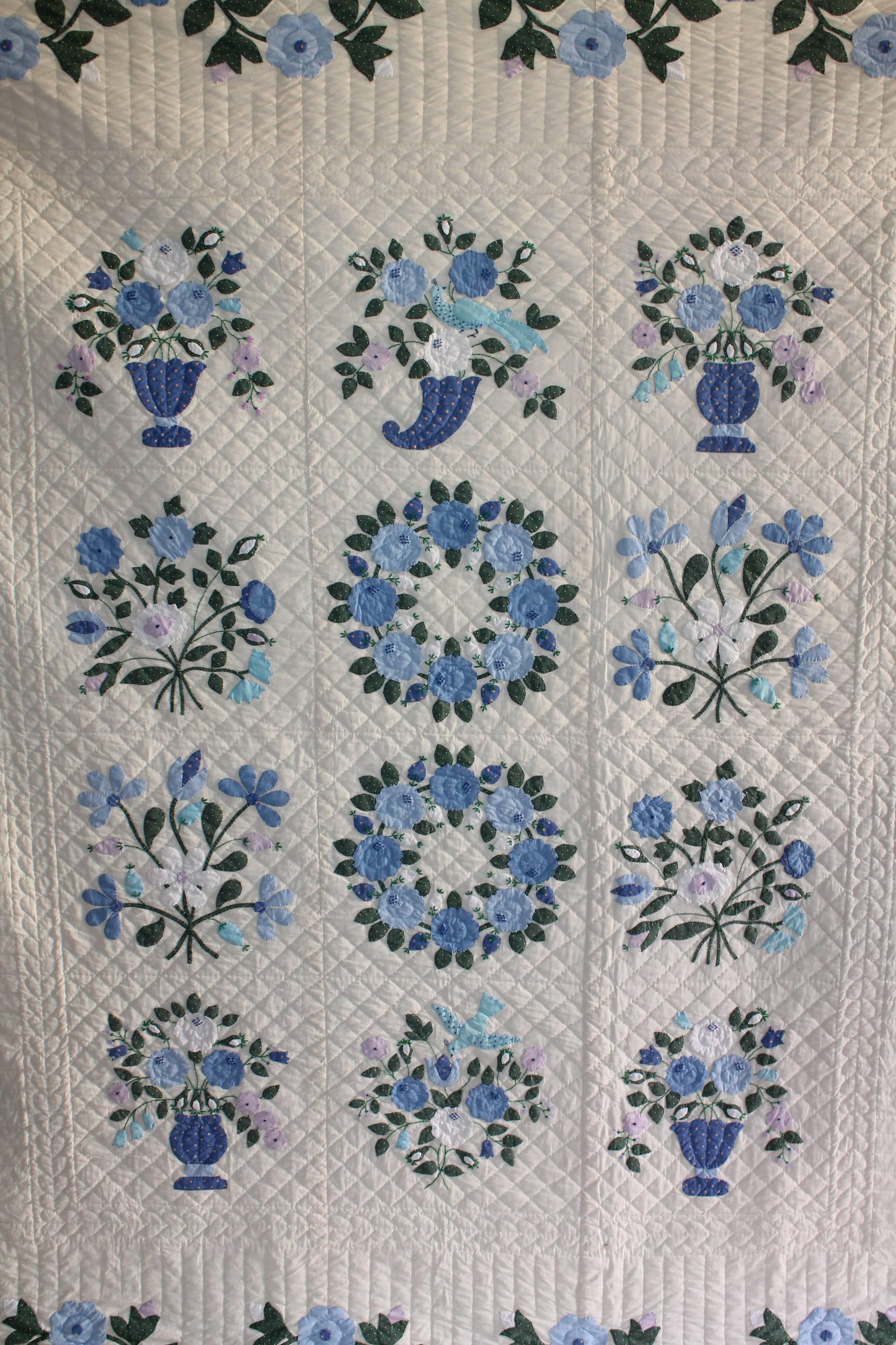 This fine example of great workmanship is in good condition with fine detail quilting and applique work. The quilt is comprised of just blue and white with hints of green. The stitching of the quilting and applique work is the very best.