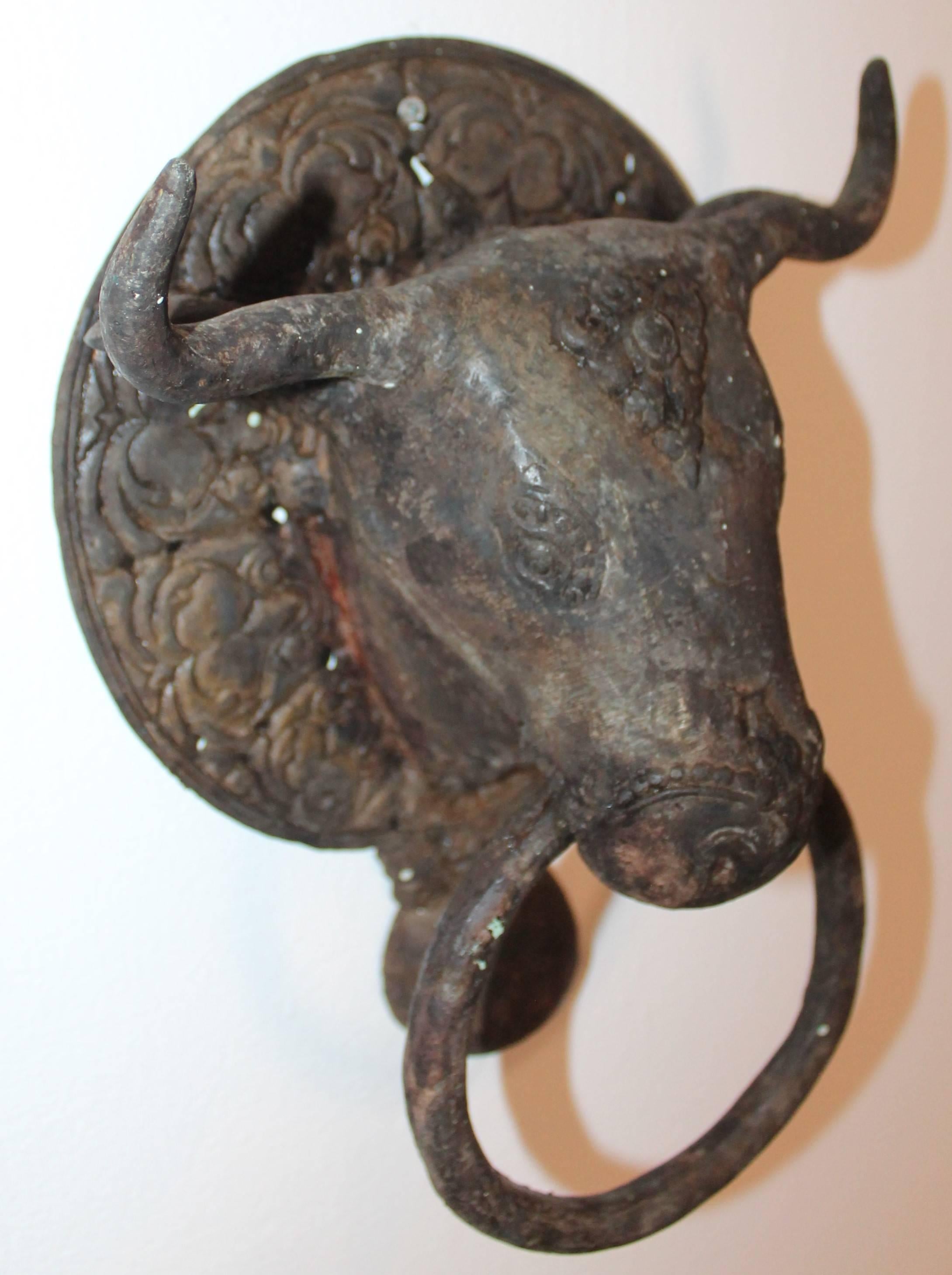 19th century Spanish cast iron bull door knocker from Mexico. The condition is very good. This is in great condition and in great working order.