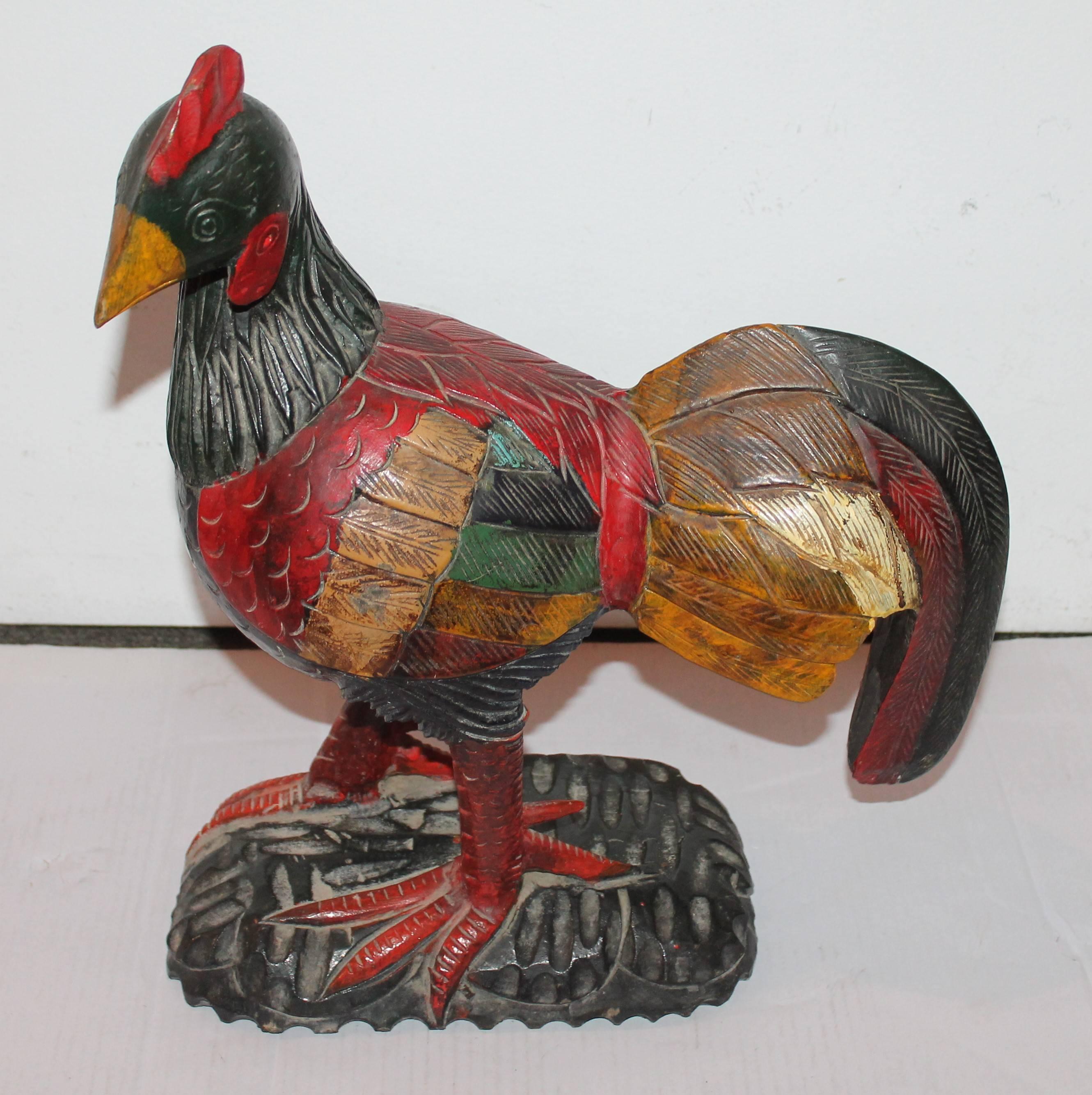 This folky hand-carved rooster has a wonderful painted surface and in great condition. This big guy has no markings as to wear it is from and we are assuming it is from Mexico. The untouched painted surface is truly wonderful and very whimsical.