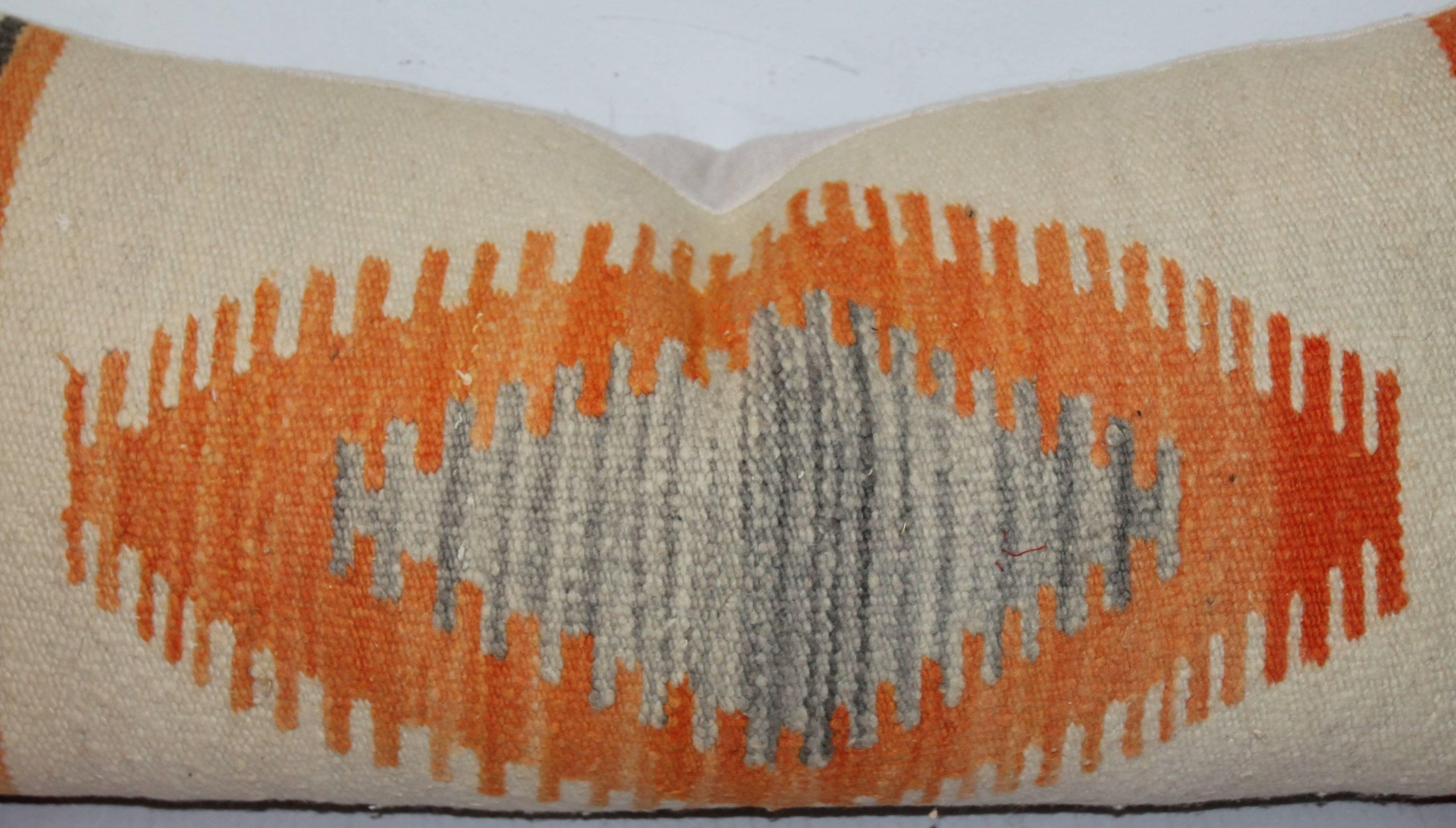 This is early and vibrant Indian weaving bolster is in very good condition. It has a 19th century cotton linen backing.