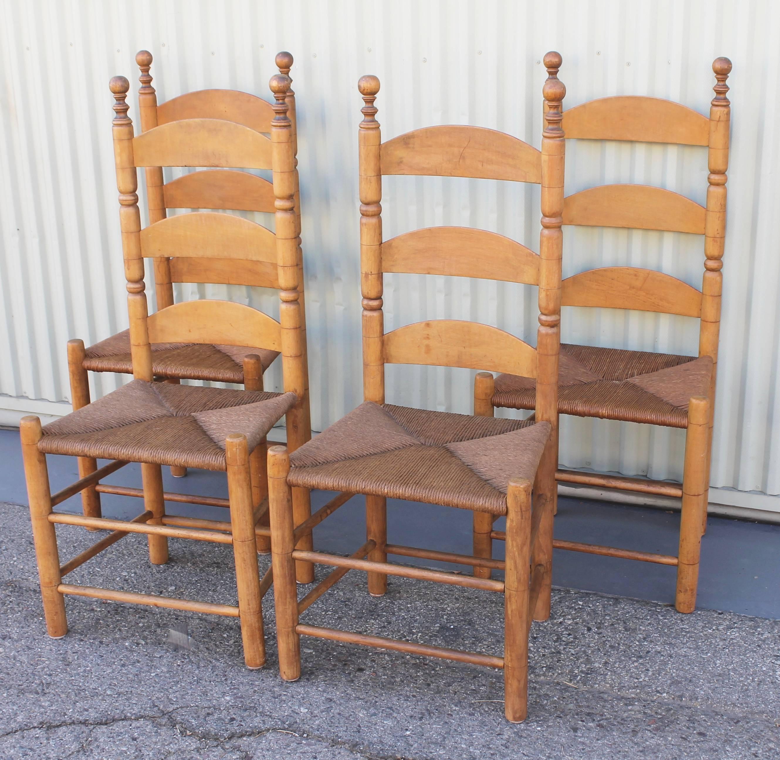 19th century original old surface ladder back chairs with hand woven rush seats. These new England chairs are in fine as found condition and have a great aged patina.