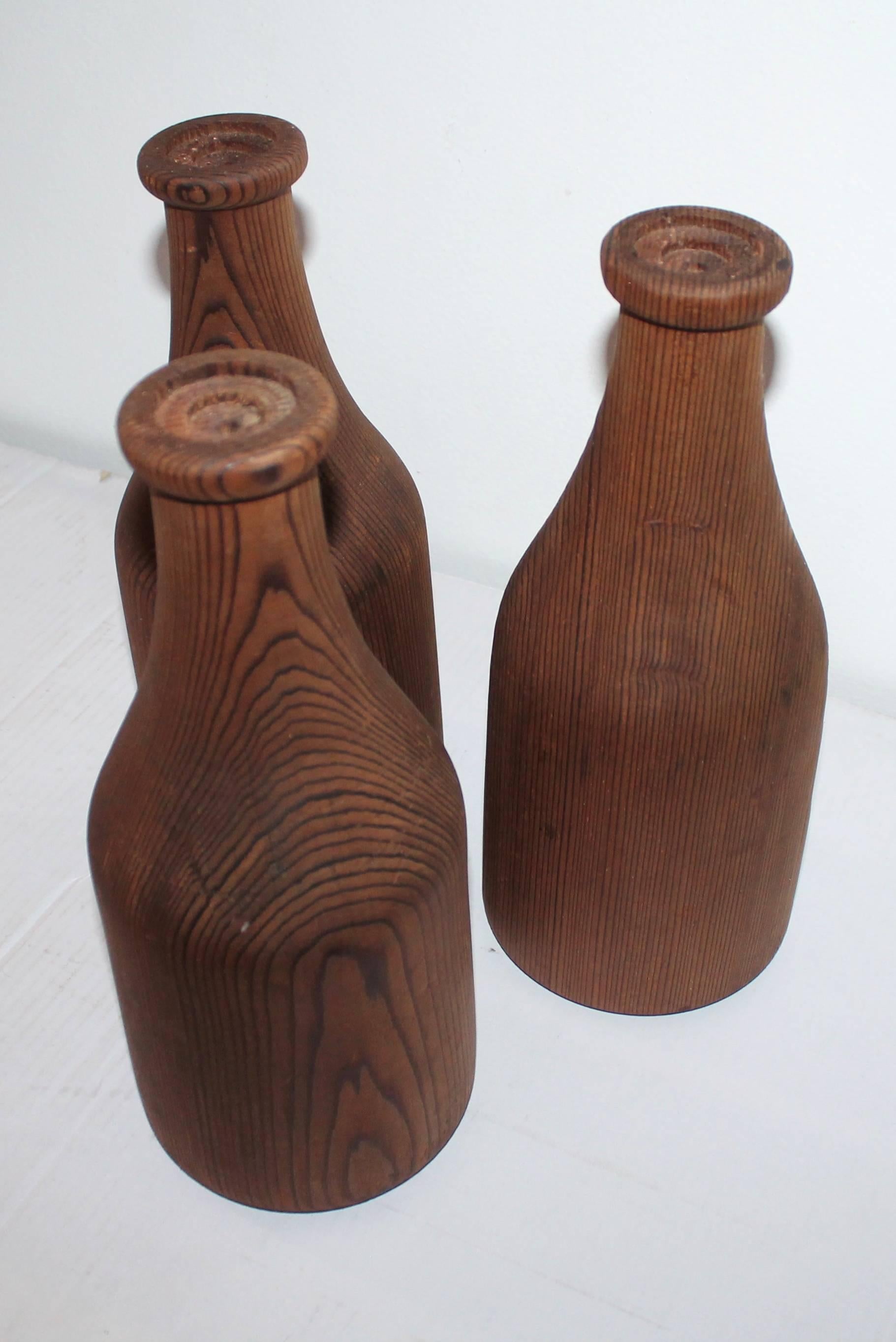 American Group of Three Folky Wood Carnival Milk Bottles For Sale