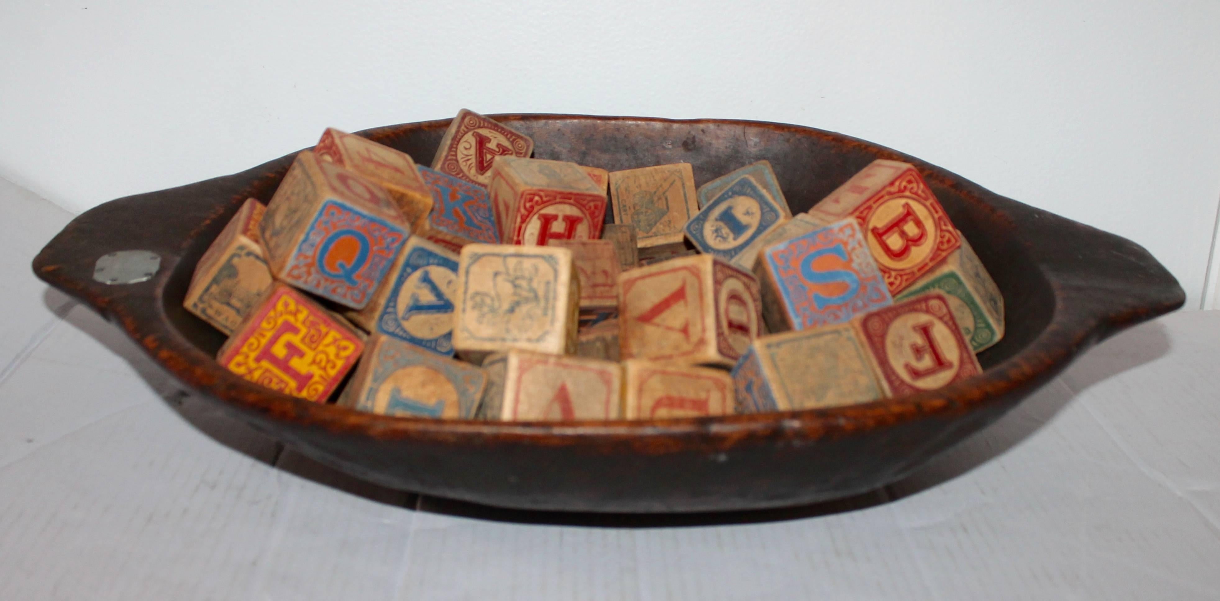 This amazing collection of hand-painted and carved children blocks are in good as found condition. The larger cubes are 2 inches squares and the other
smaller cubes are 1 inches squares. There are over 100 blocks in all. Great in a basket or small