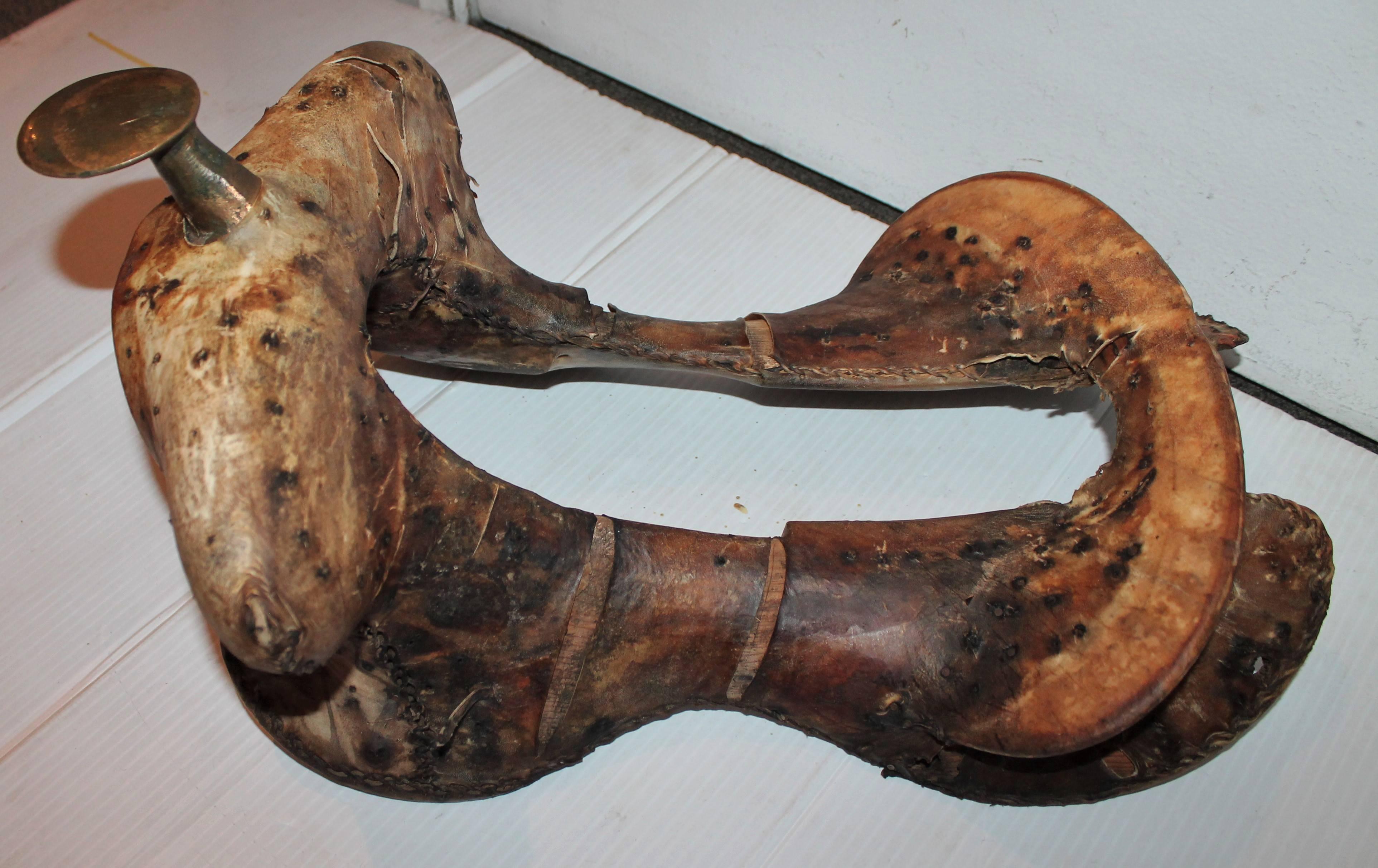 This rustic cow hide or rawhide over wood saddle form was found in Texas and is in as found condition. This is known as the saddles base or tree form.