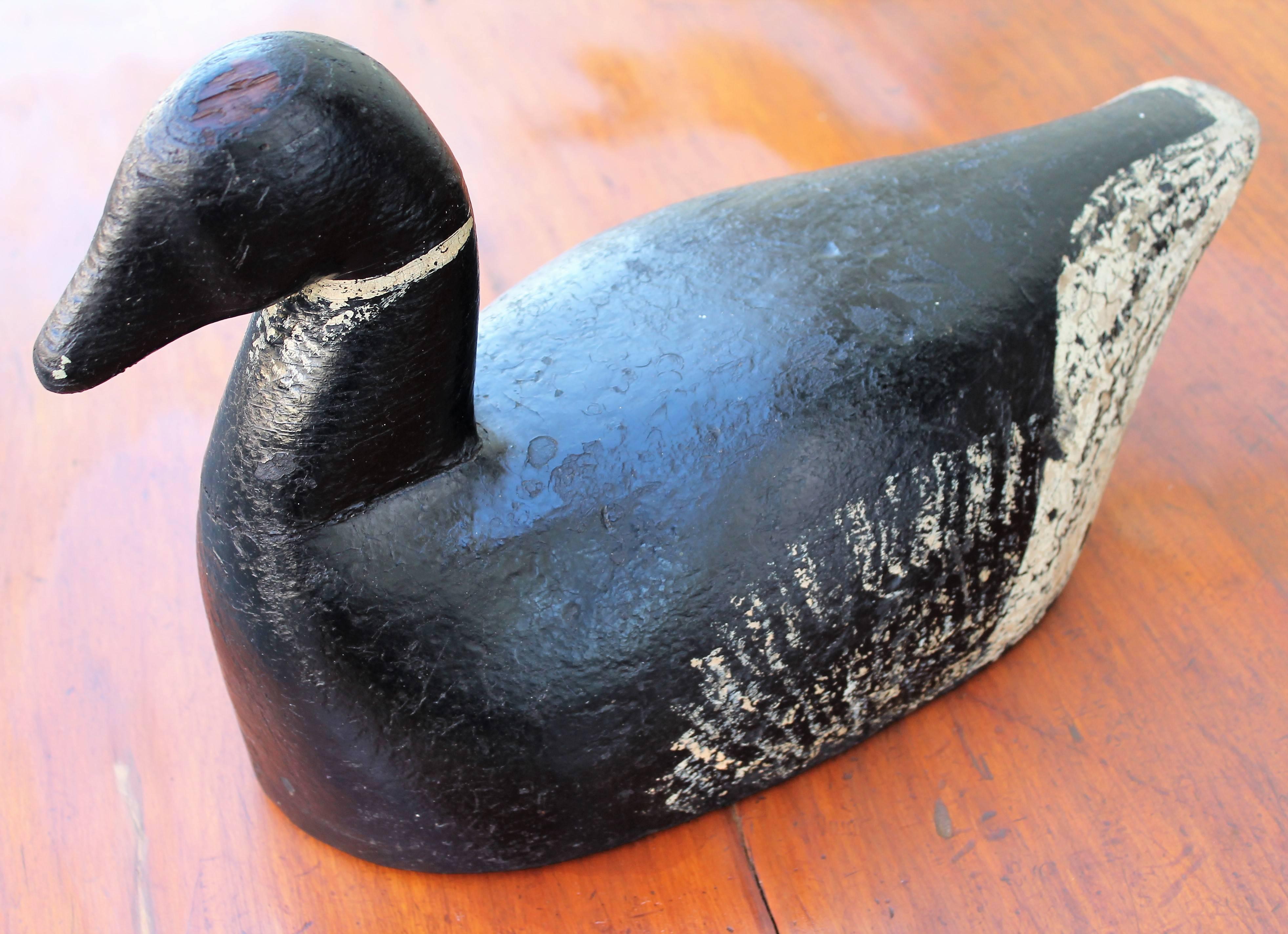 Early 20th century original painted large Canadian goose from the collection of Harry Walsh purchased in Easton, Pennsylvania. This was made in Virginia. The condition is very good with missing paint and weights on base. This is common from age and
