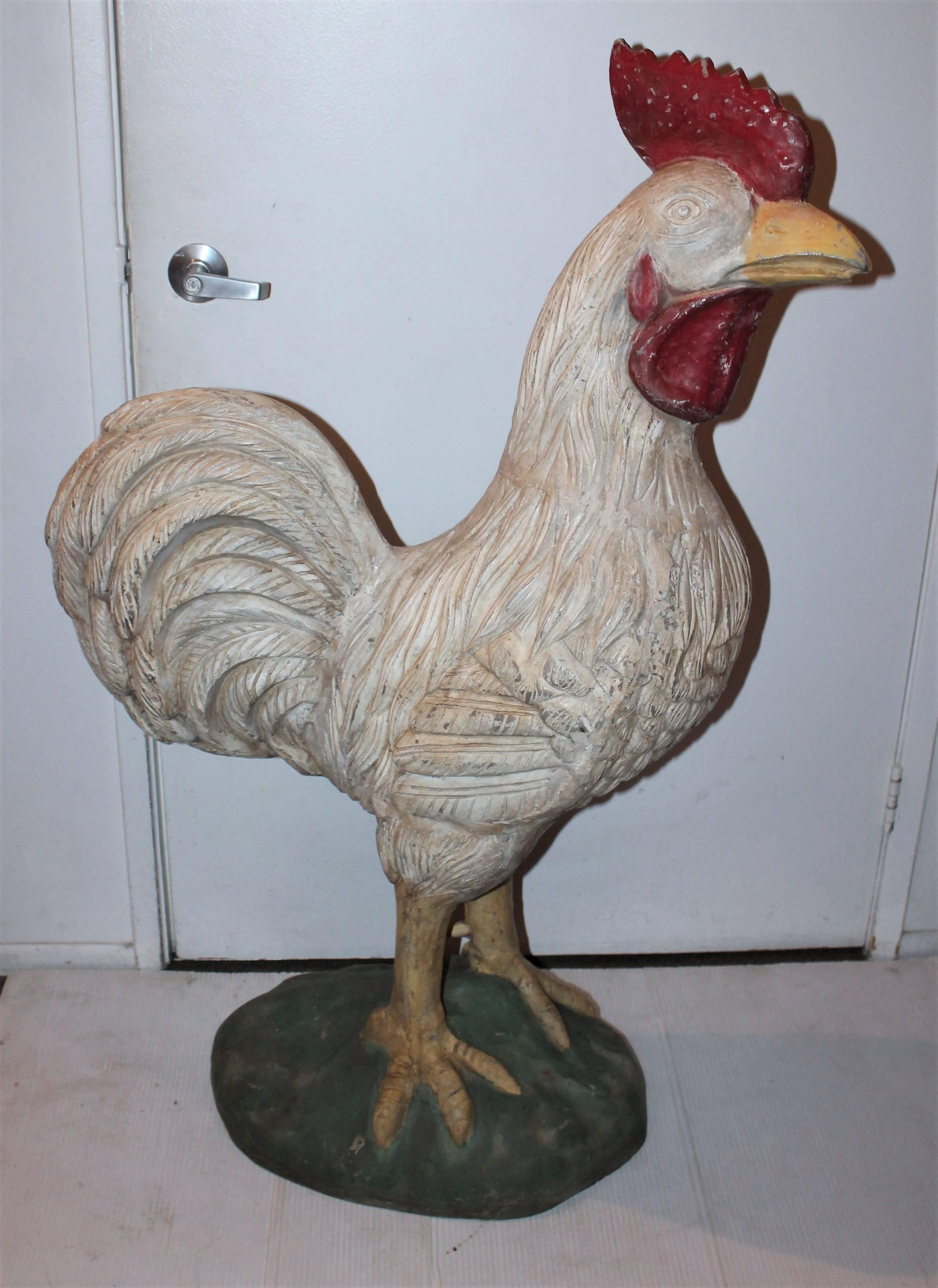 This big chicken is a hollow body zinc trade sign. It probably came from a roof top of a chicken restaurant or chicken farm. It is so amazing and has wear on it's repainted surface. These type trade signs or figures were commonly repainted or