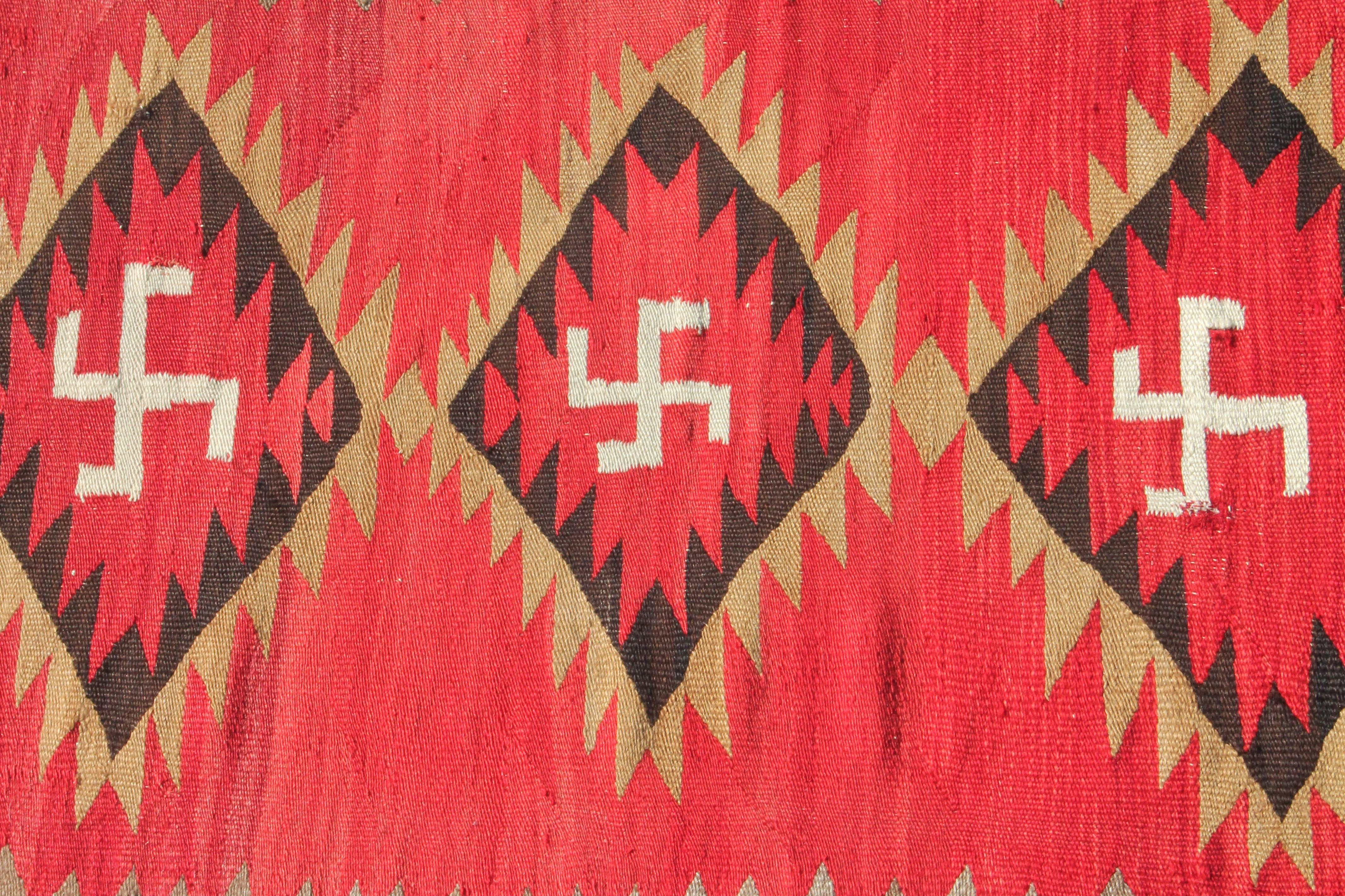 Early Navajo transitional weaving in good condition. This item shows minor wear consistent with age and use. The three central diamonds have a 