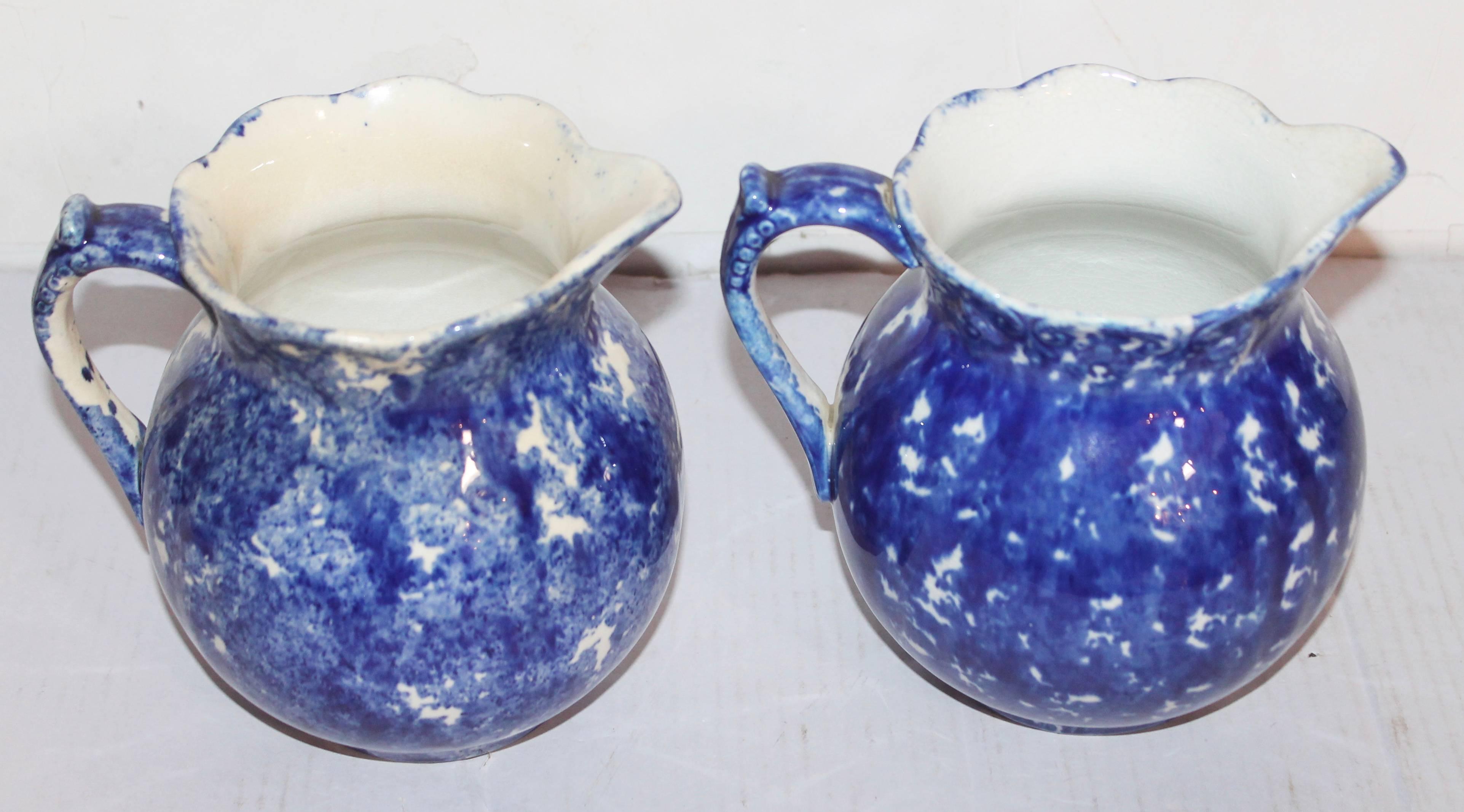 Two 19th century American sponge ware pottery pitchers are in good condition. These wonderful hand-painted glazed pitchers have a handmade look.
