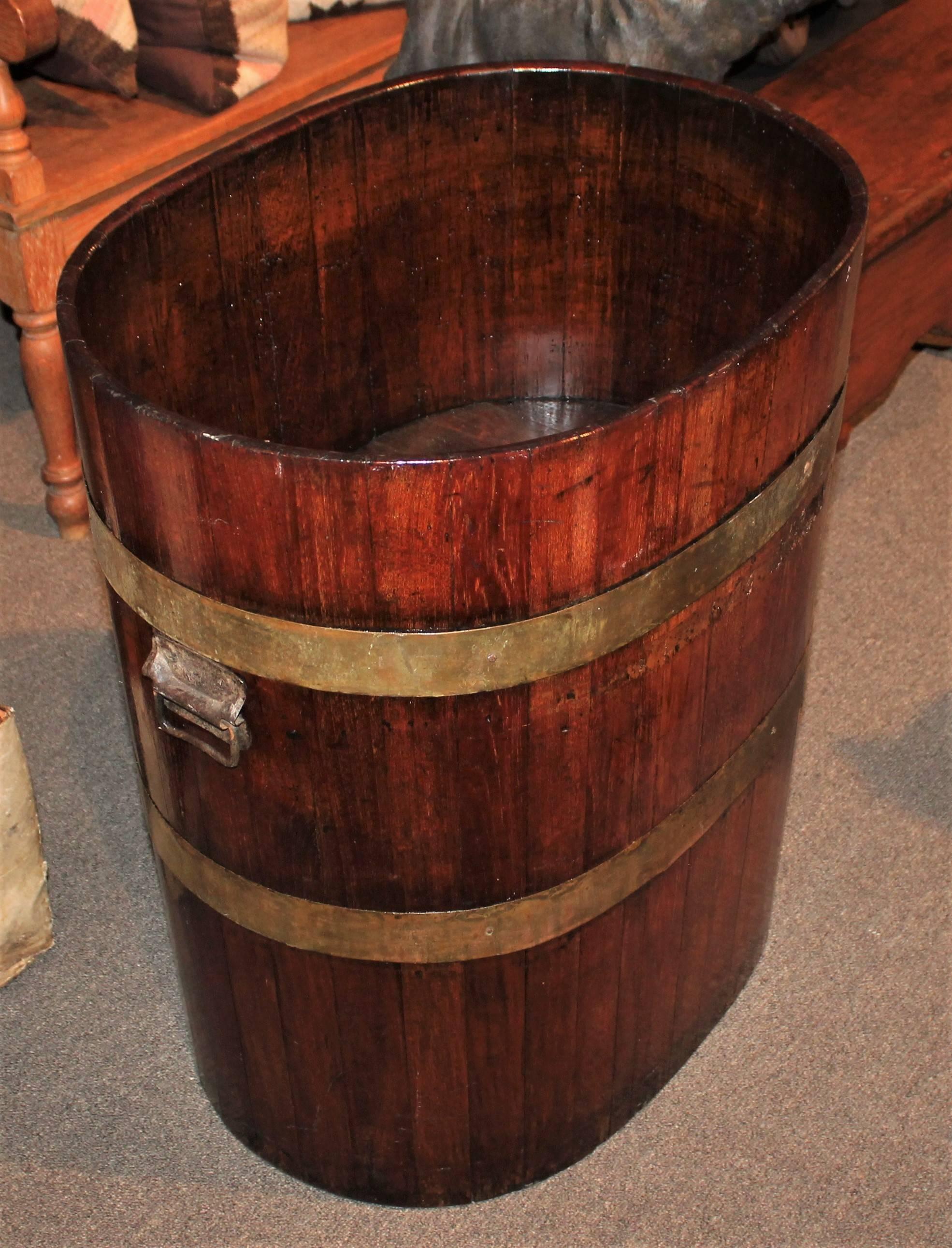 19th century barrel with original brass strapping's. This amazing barrel is in great condition and has been re-varnished for strength and stability. It had a light original varnish before hand. This also could have been used in a old general store.