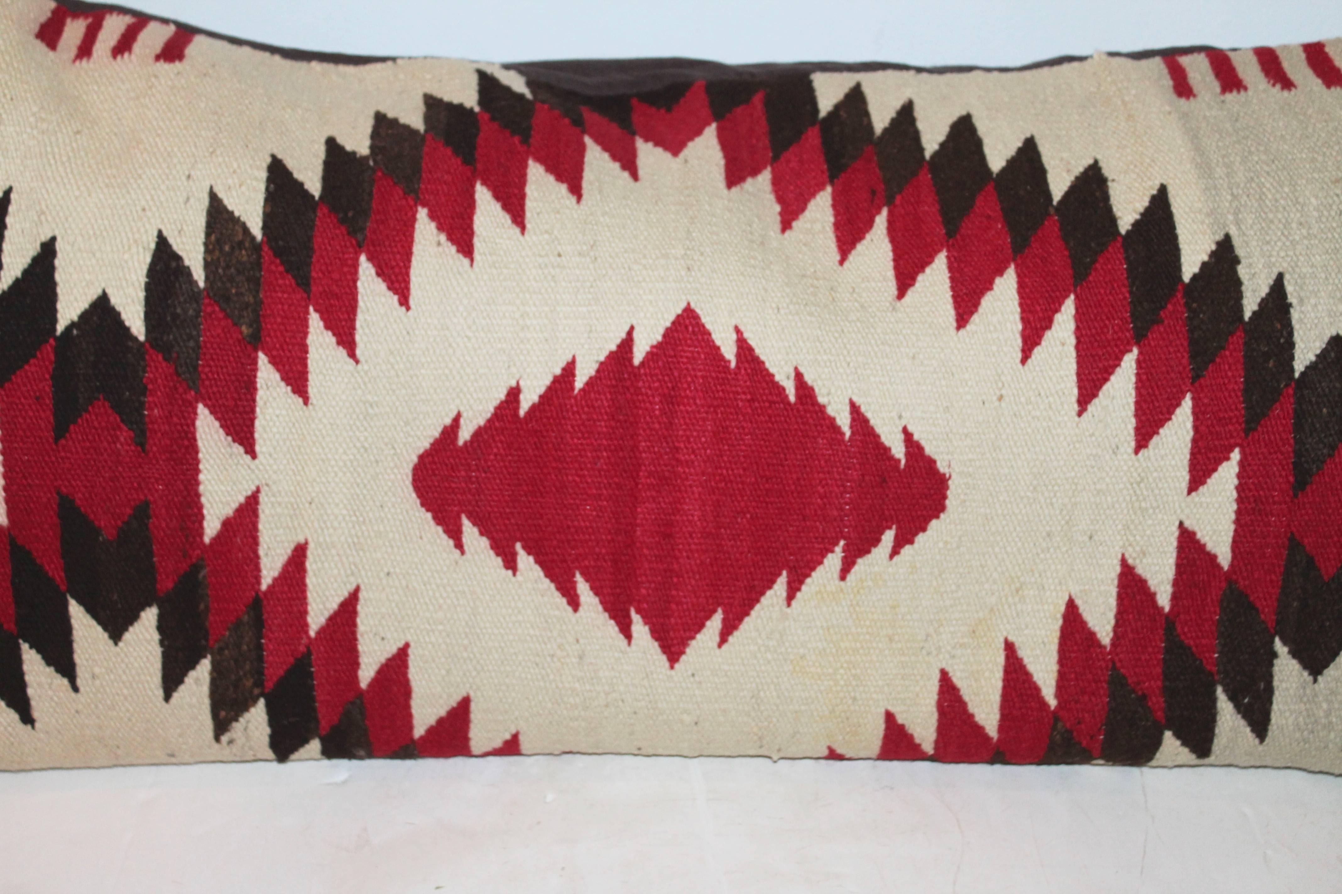 This fine and early Navajo weaving bolster pillow has the four lines on the sides for trading pelts or skins in trade for the Indian weaving. Condition is very good with a black cotton linen backing.