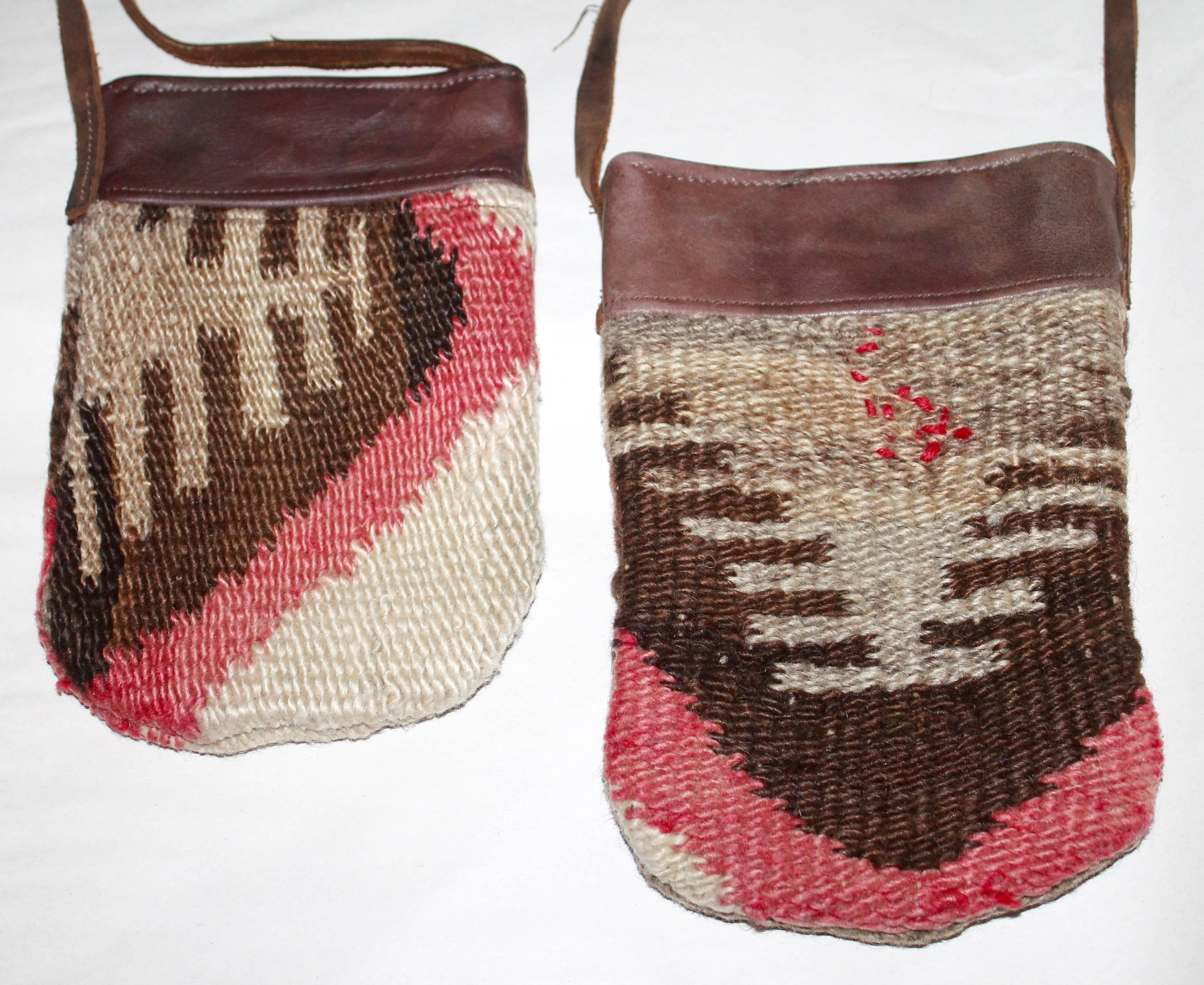 Pair of handmade Navajo weaving and leather trim shoulder bags. These high quality bags are in great condition. The weaving is quite early.