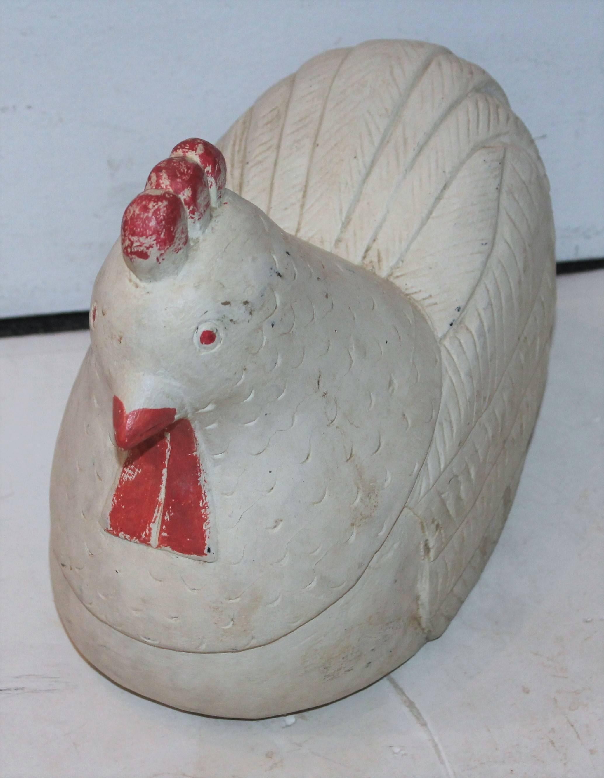 This fine example of early 20th century Folk Art is all original paint and carved from one piece of wood. The weight is heavy and would make a great doorstop in the kitchen.