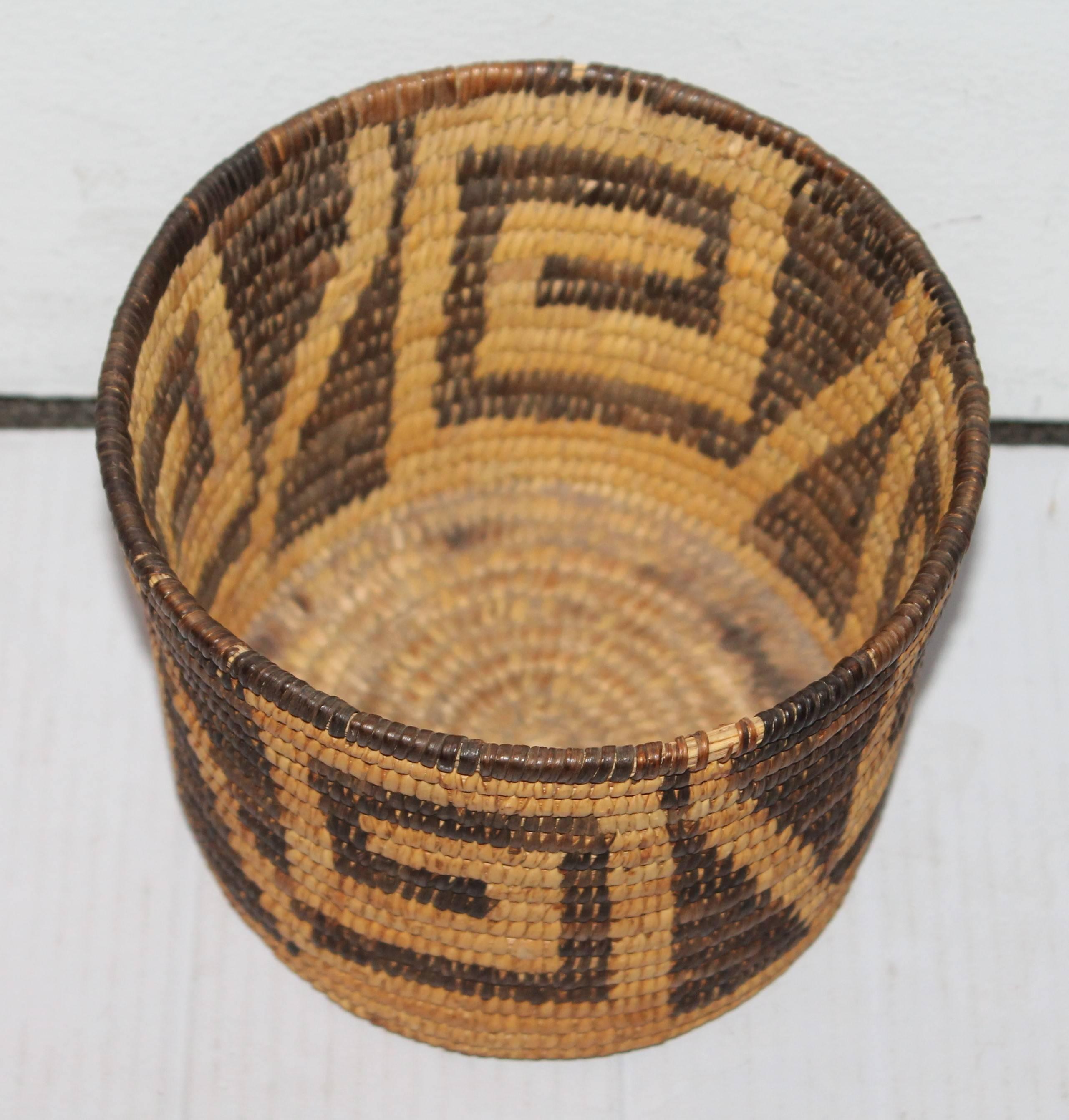 This very interesting geometric Papago Indian basket is in nice condition with a very deep dark coloration in the coils. The size is a great addition to any basket collection.