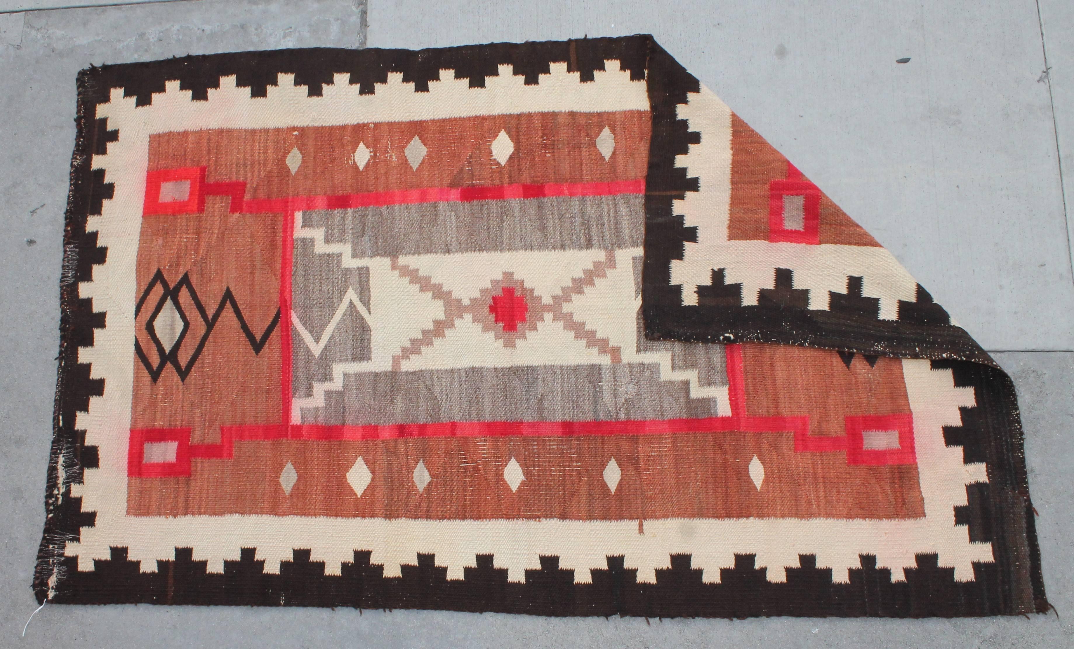 19th century Navajo Indian storm pattern weaving or rug in fantastic faded colors. Minor edging issues or wear. This is a wonderful aged weaving with great colors and pattern.