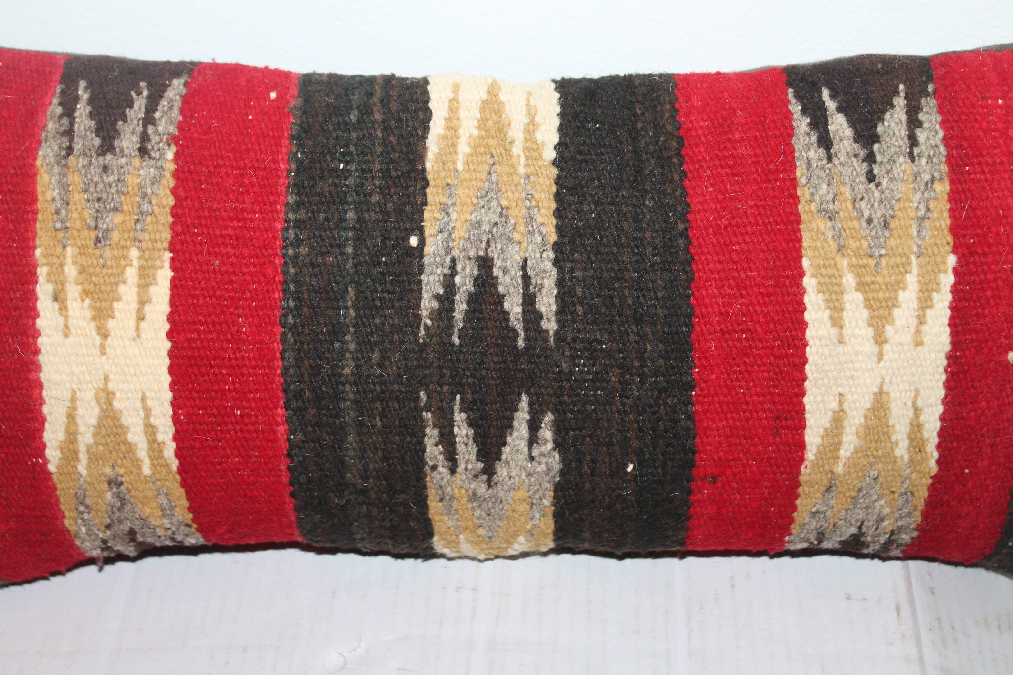 This amazing weaving pillow is in fine condition and is in a smaller scale. The backing is in a dark chocolate cotton linen backing.
