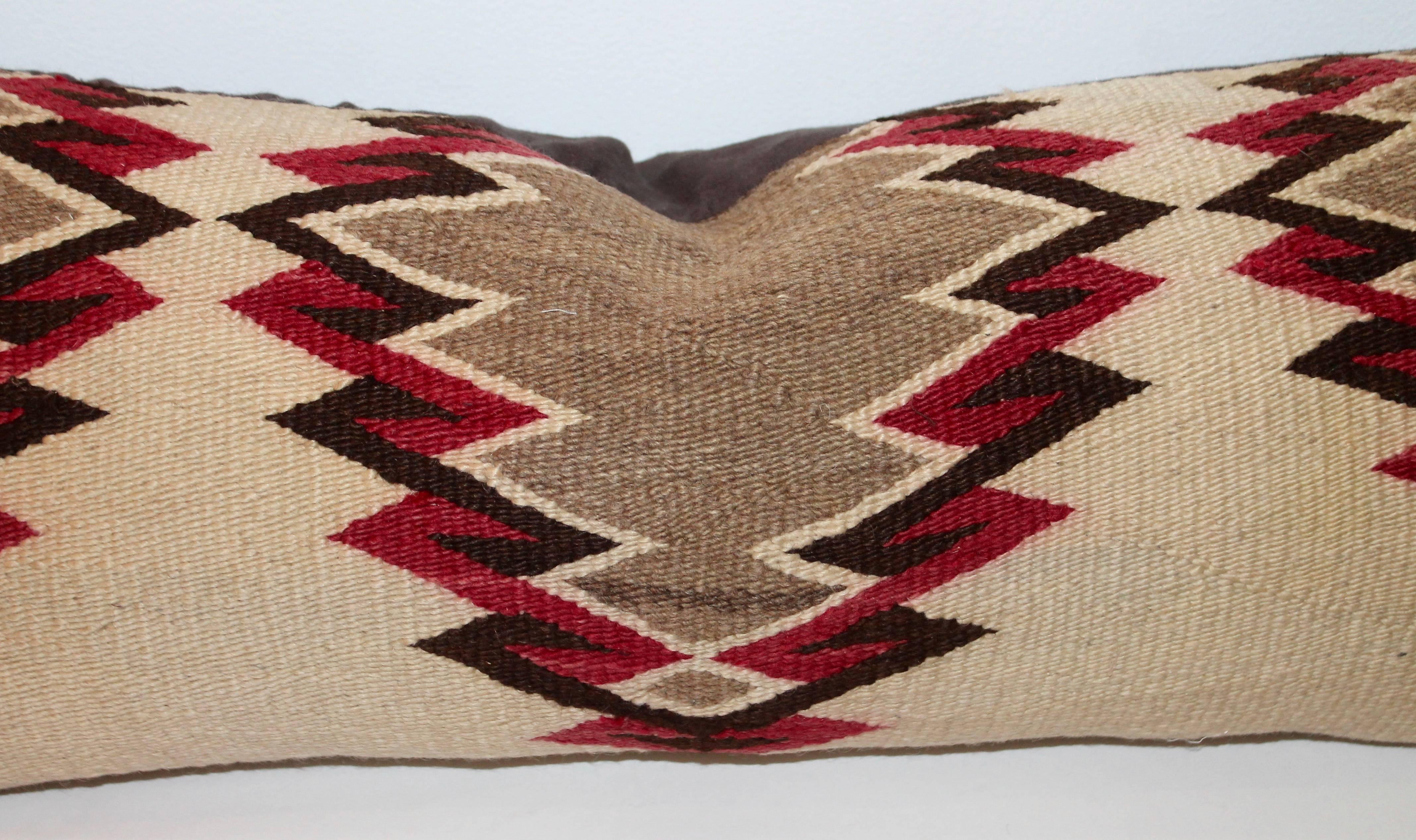 This fine Navajo weaving is in great condition and most unusual colors. The backing is in a chocolate brown cotton linen.