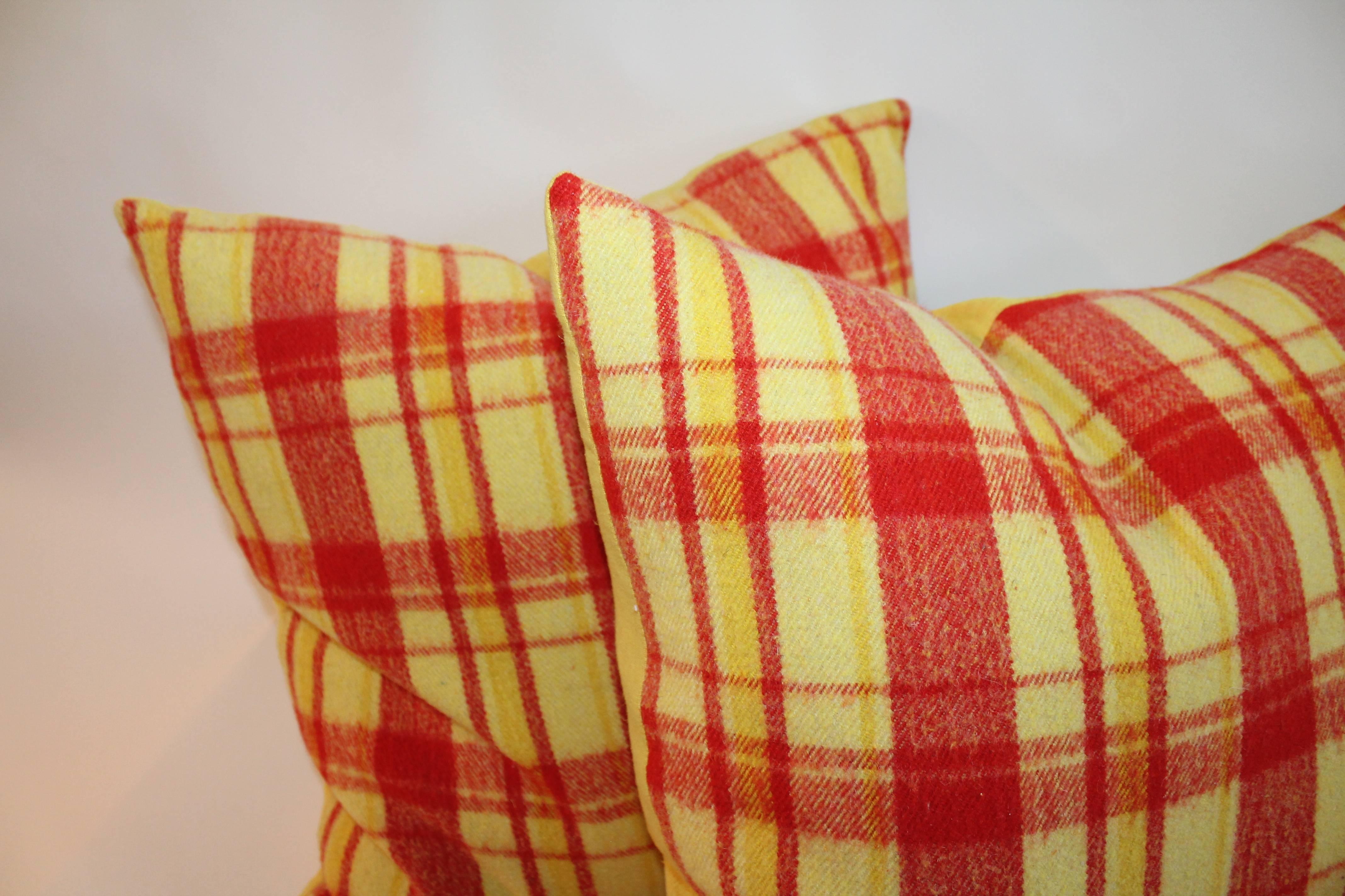 These funky and vibrant plaid wool horse blanket pillows have yellow cotton backing. Wonderful vintage colors.