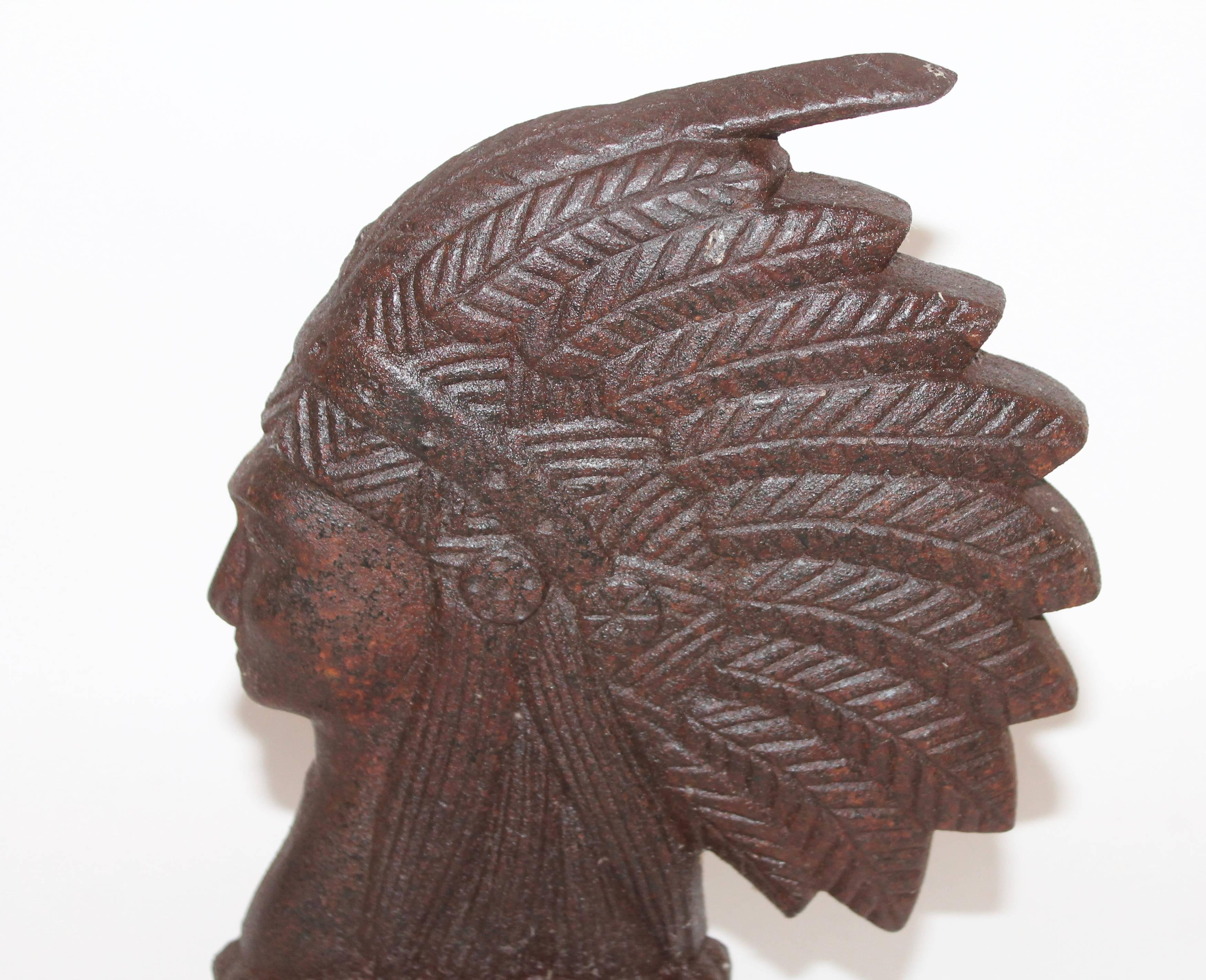 This is the most unusual Native American cast iron door stop we have ever seen! The back of it has fragments of paint and paint loss. This has a wonderful worn patina. Manufacturer probably Hubly Iron Works.
