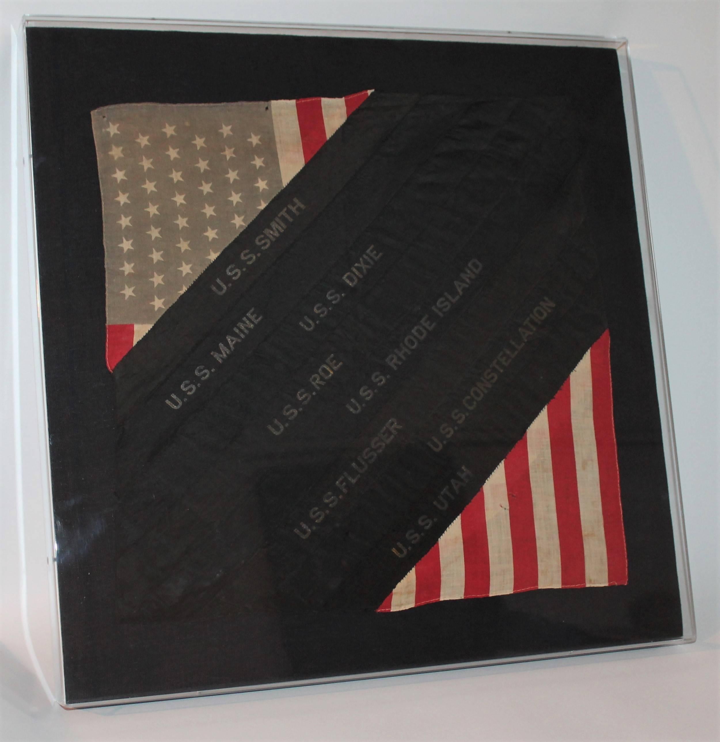 This Great framed Folk Art sham with 48star flag and ship ribbons is a great patriotic item. The top left corner as well as the bottom right corner are scraps of a 48 star linen flag and in between them are ribbons of ships names that are sewn