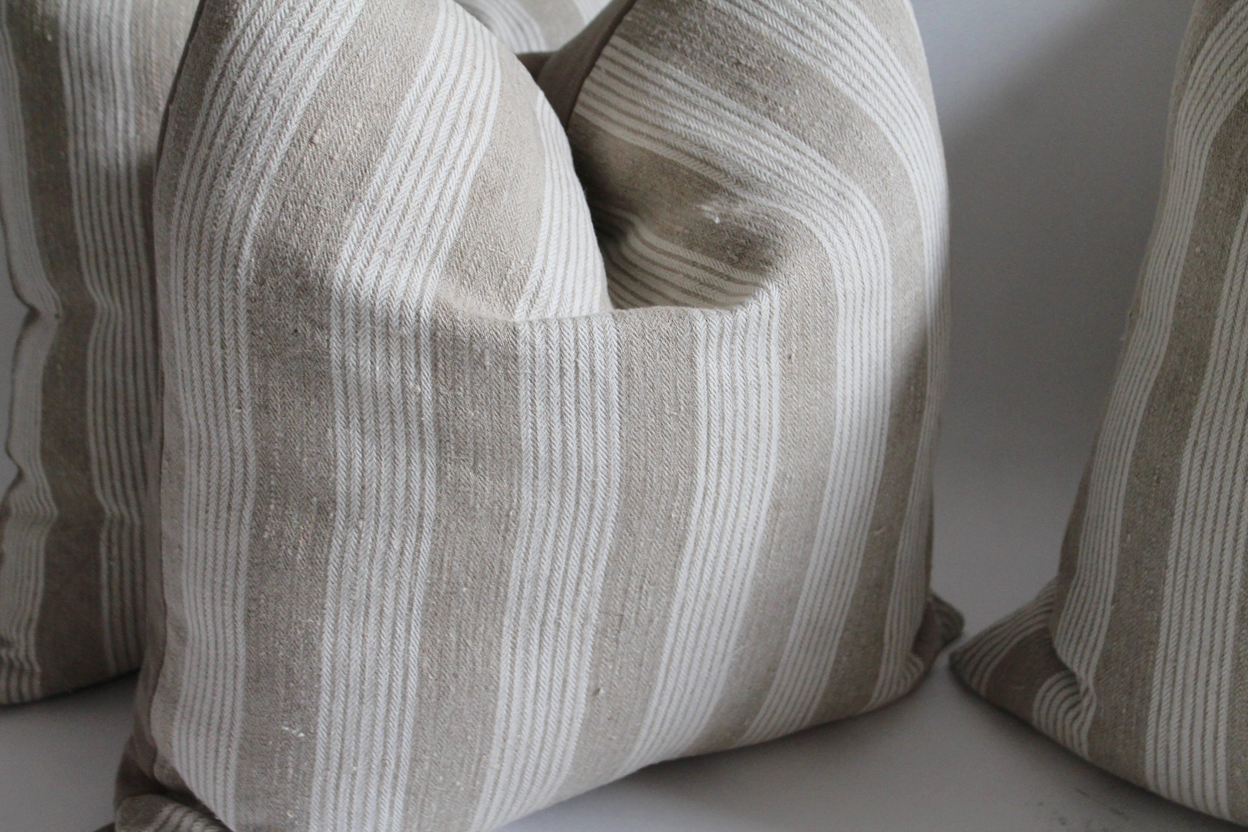 These fine striped home spun linen pillows are sold in pairs or all four as a collection. The backing is a cream cotton linen. 795.00 pair / 1395.00 for the four. All in fine condition.