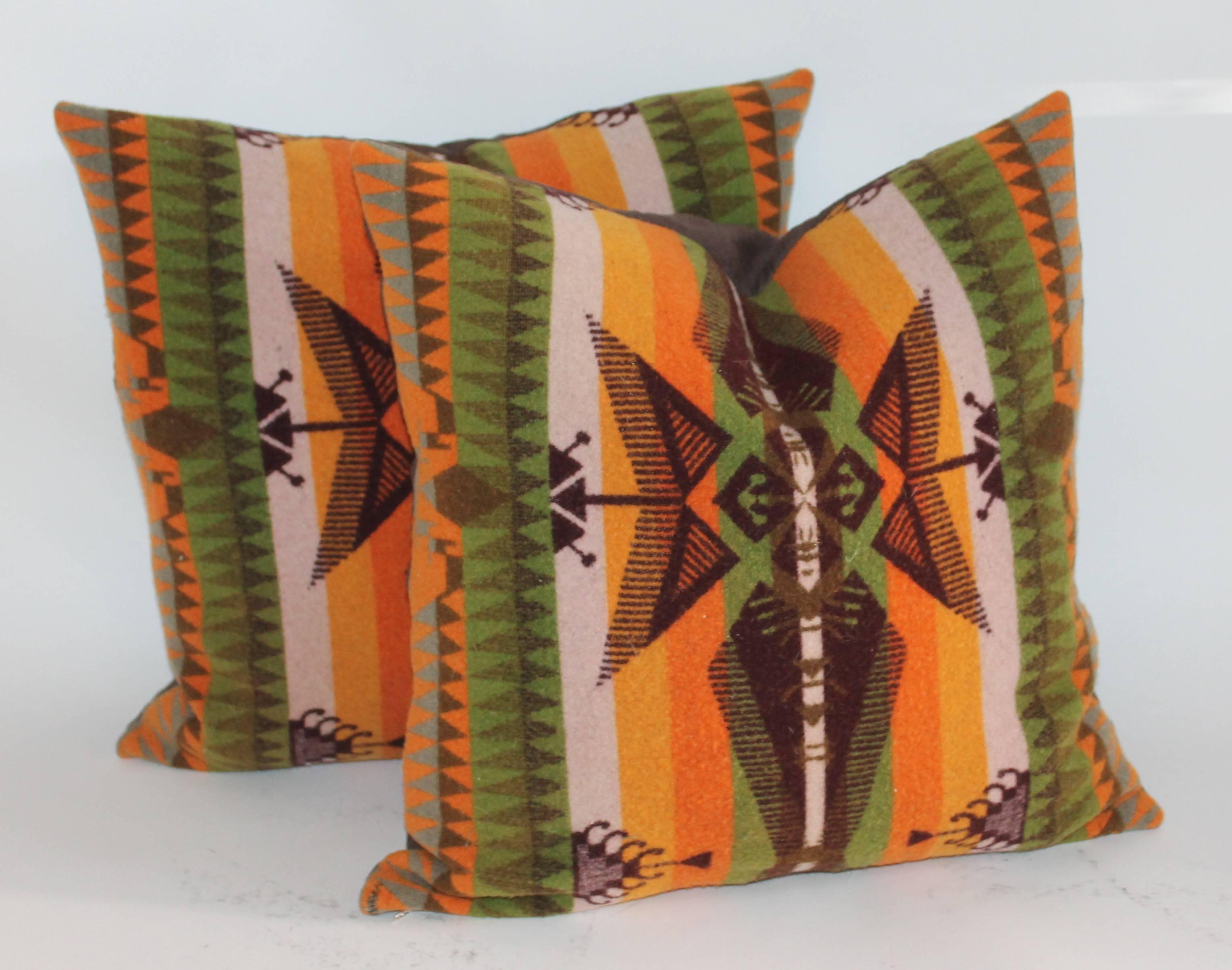 These fine and most unusual Indian design camp blanket pillows are in pristine condition and have chocolate cotton linen backings. Down and feather fill.