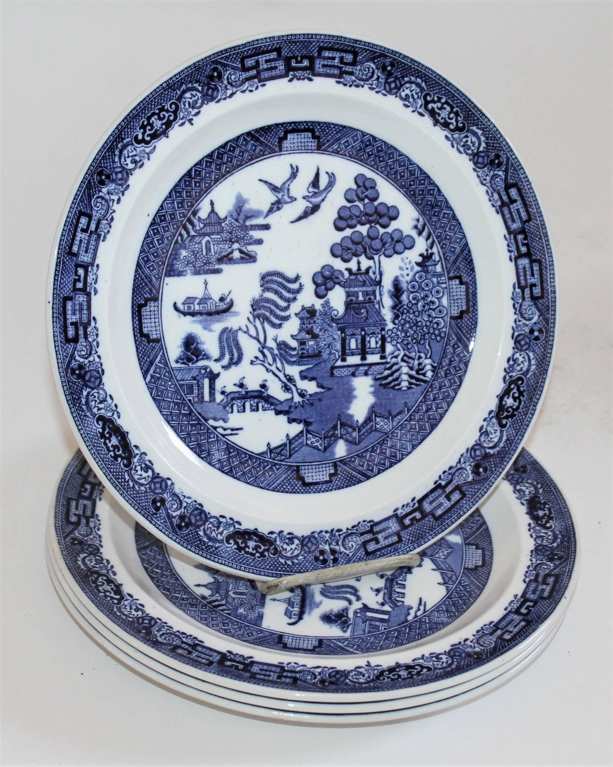 Pristine set of four blue willow platters in amazing condition. 
This specific insignia was only used for a number of year starting circa 1840 up to circa 1870s for a short period and only found on high-quality goods made by Wedgewood. These plates