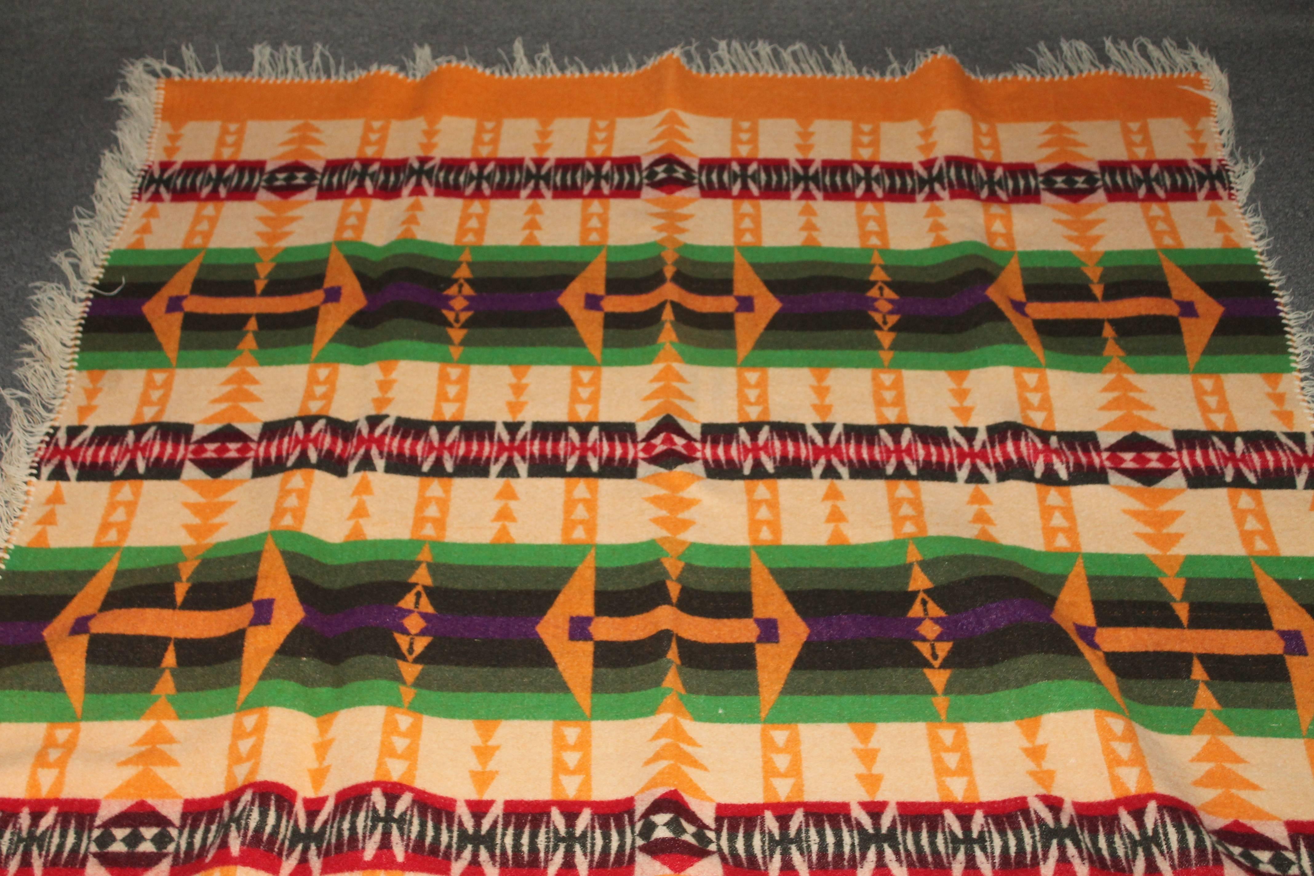 This fine camp blanket has amazing and most unusual colors in pristine condition. This cheddar back round color is very special and retains its original Cayuse label and dated 1909 on the black label.