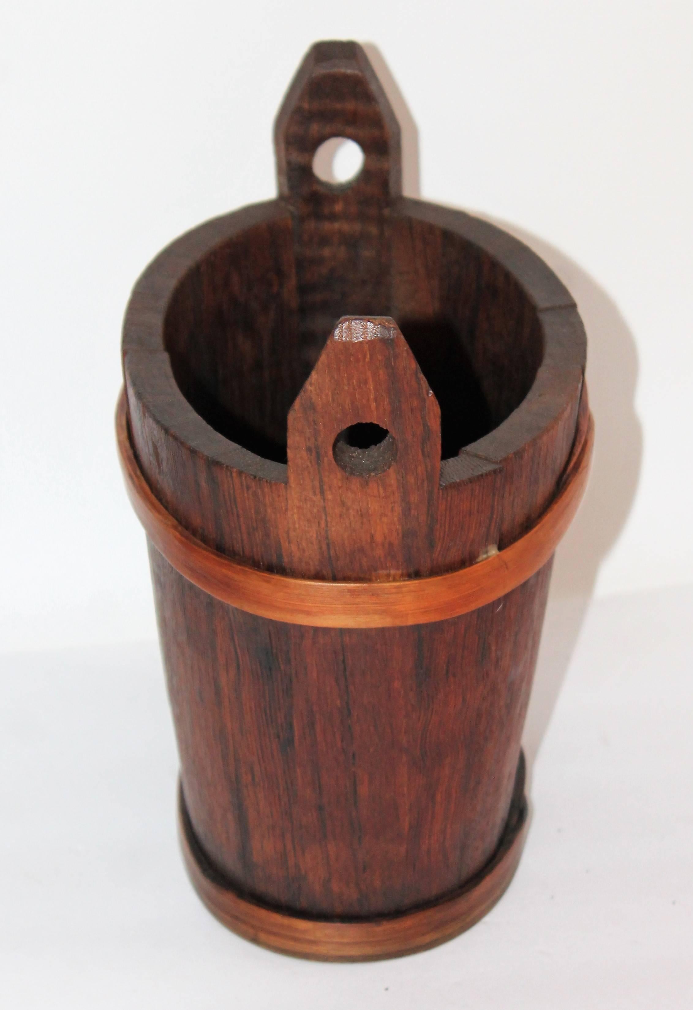 This fantastic piggin is all hand-carved and is in a Shaker style format. The double handled bucket has hand-carved handles and handmade wraps. The condition is very tight and sturdy.
