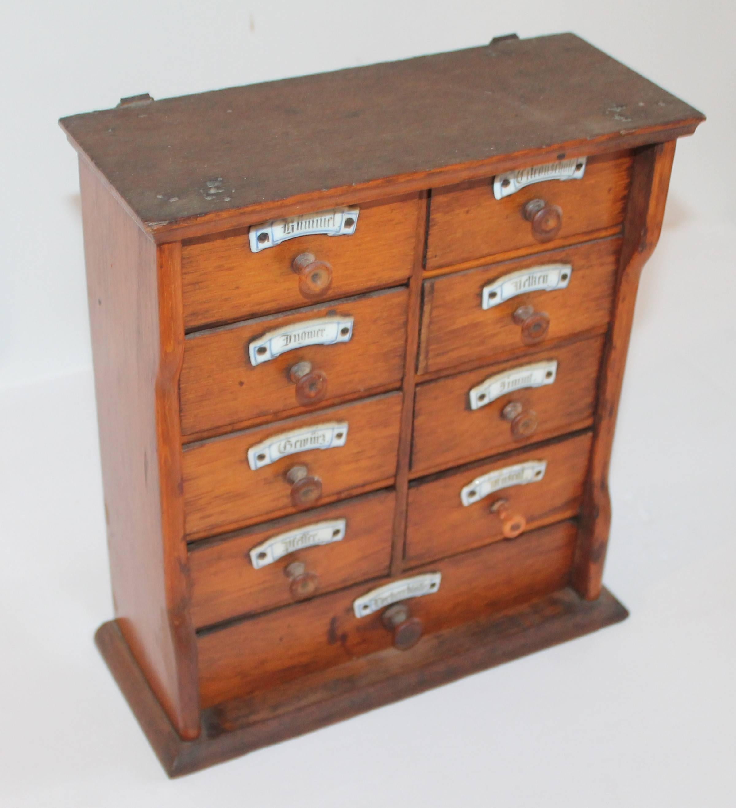 This pristine 19th century handmade German spice box with original ironstone labels is in amazing condition. This item is all original from the drawers, knobs and individual ironstone labels for each drawer. There is amazing patina on this spice box
