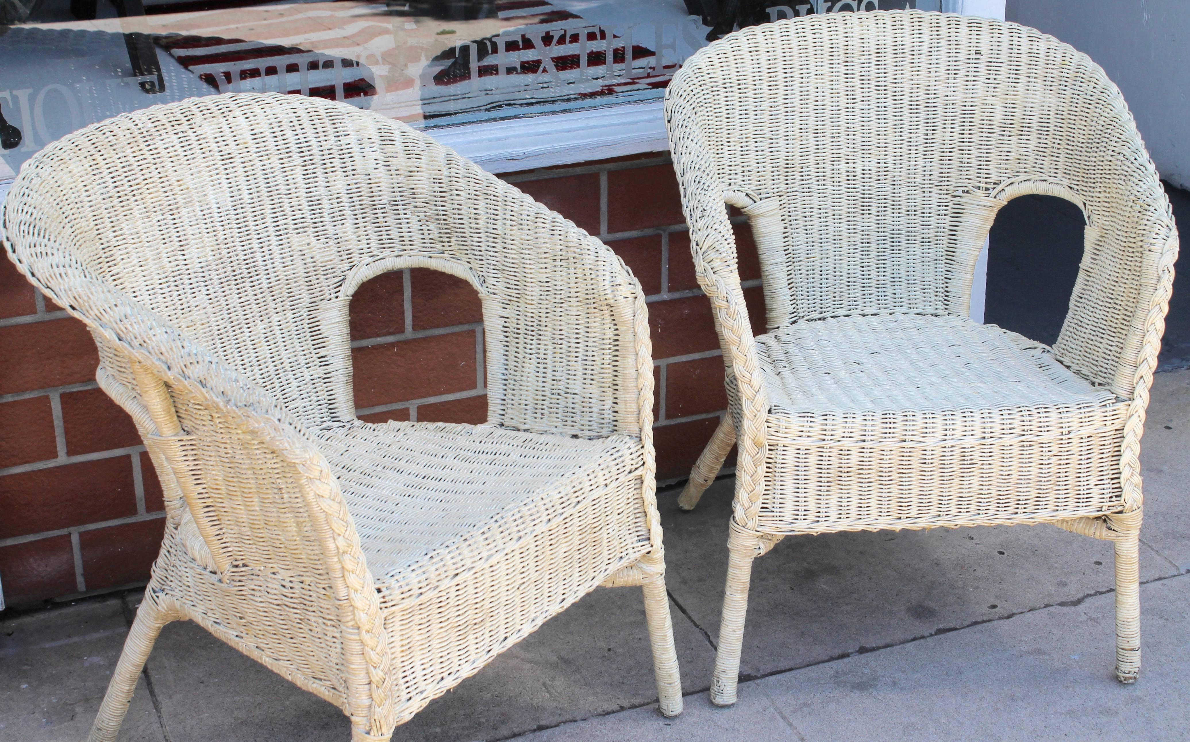 Pair of comfortable wicker chairs with white paint and have been heavily varnished. This great wicker set is in amazing condition the sides of the chair are where this set shines. The make of the wicker is seldom seen with support leading to the