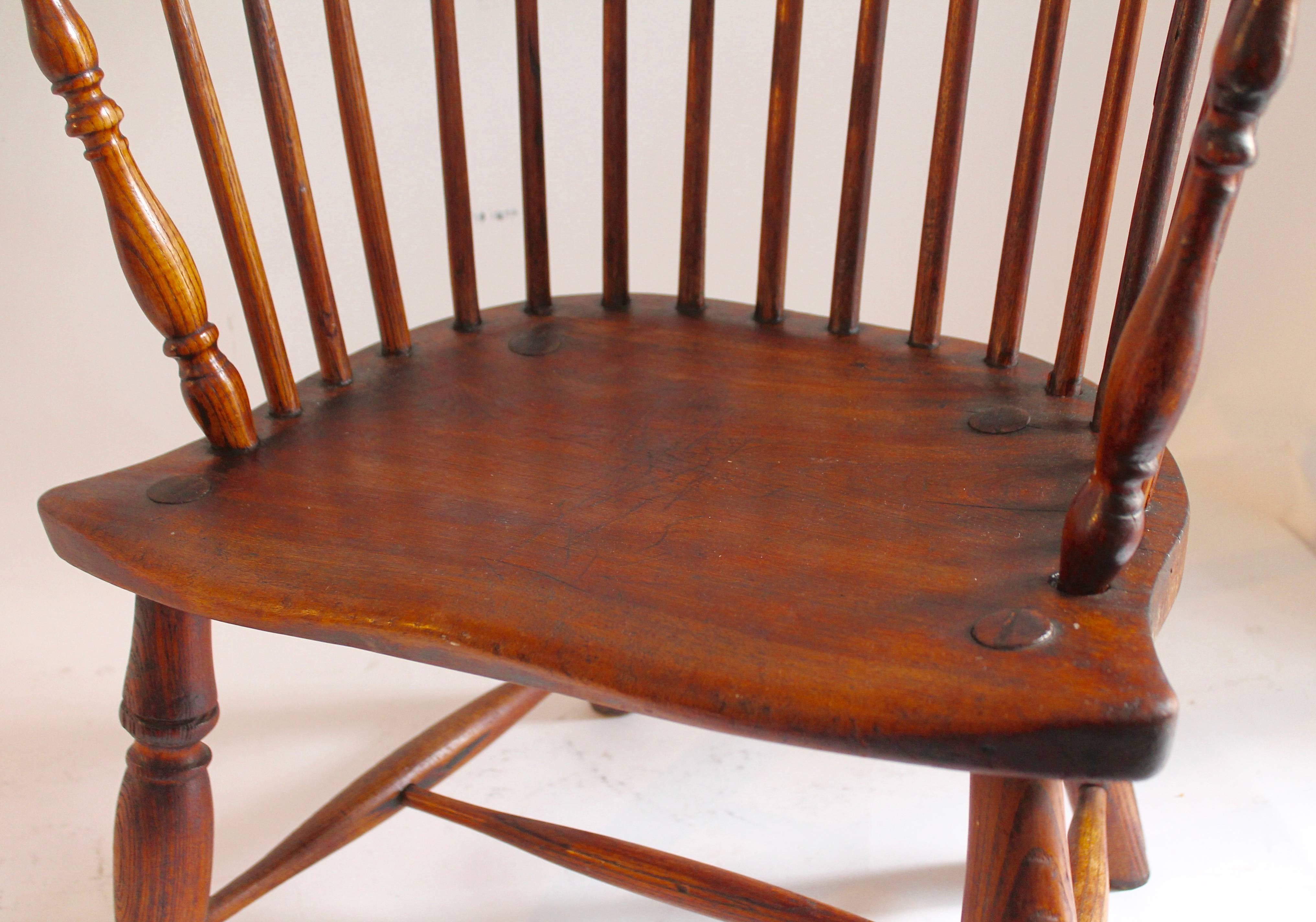 This fine and very comfortable Windsor chair is in good condition but has some minor old repairs. The backside bow has an old iron repair but is fine the way it is. Funky old repairs are great on these wonderful worn wonders. Great functional look!