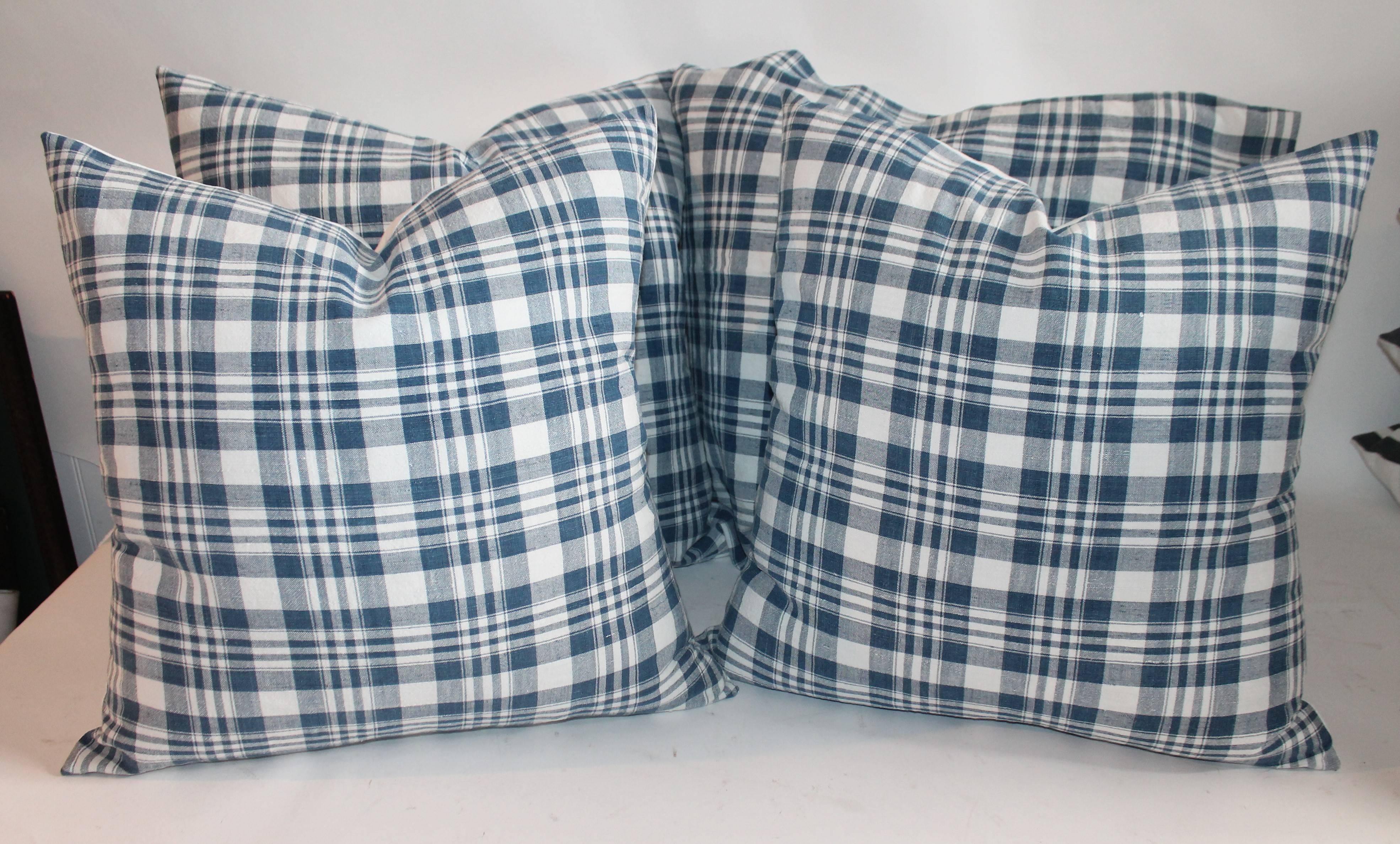 19th century blue and white homespun linen pillows. Measure: Two pairs of 20 x 20 and two pairs of 22 x 22. Sold as pairs.