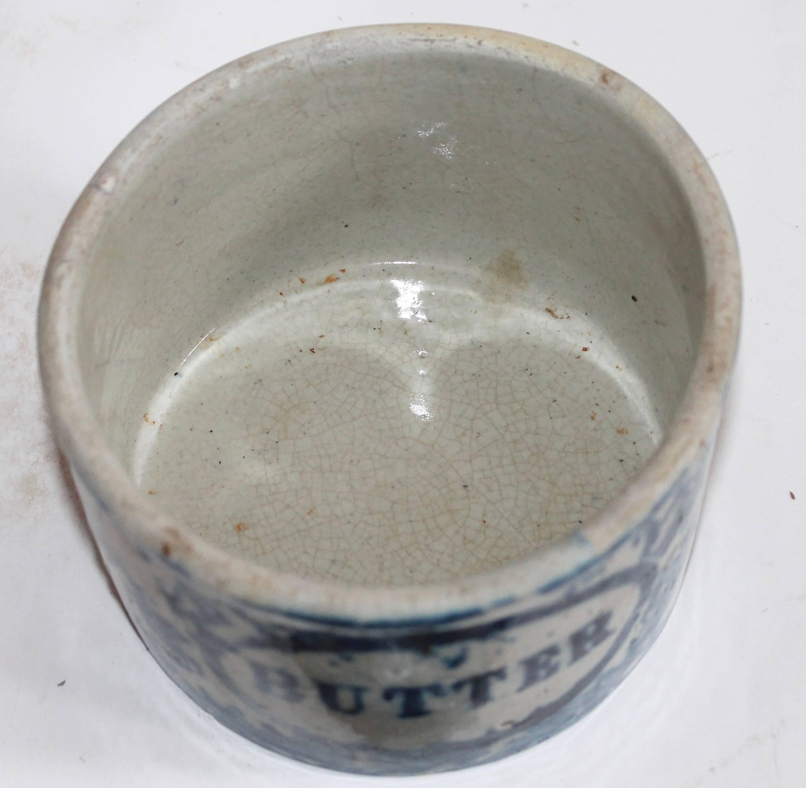 This handmade and painted butter crock was found in Pennsylvania and is in good condition with the exception of the old repairs to the lid. The base has no cracks or chips.