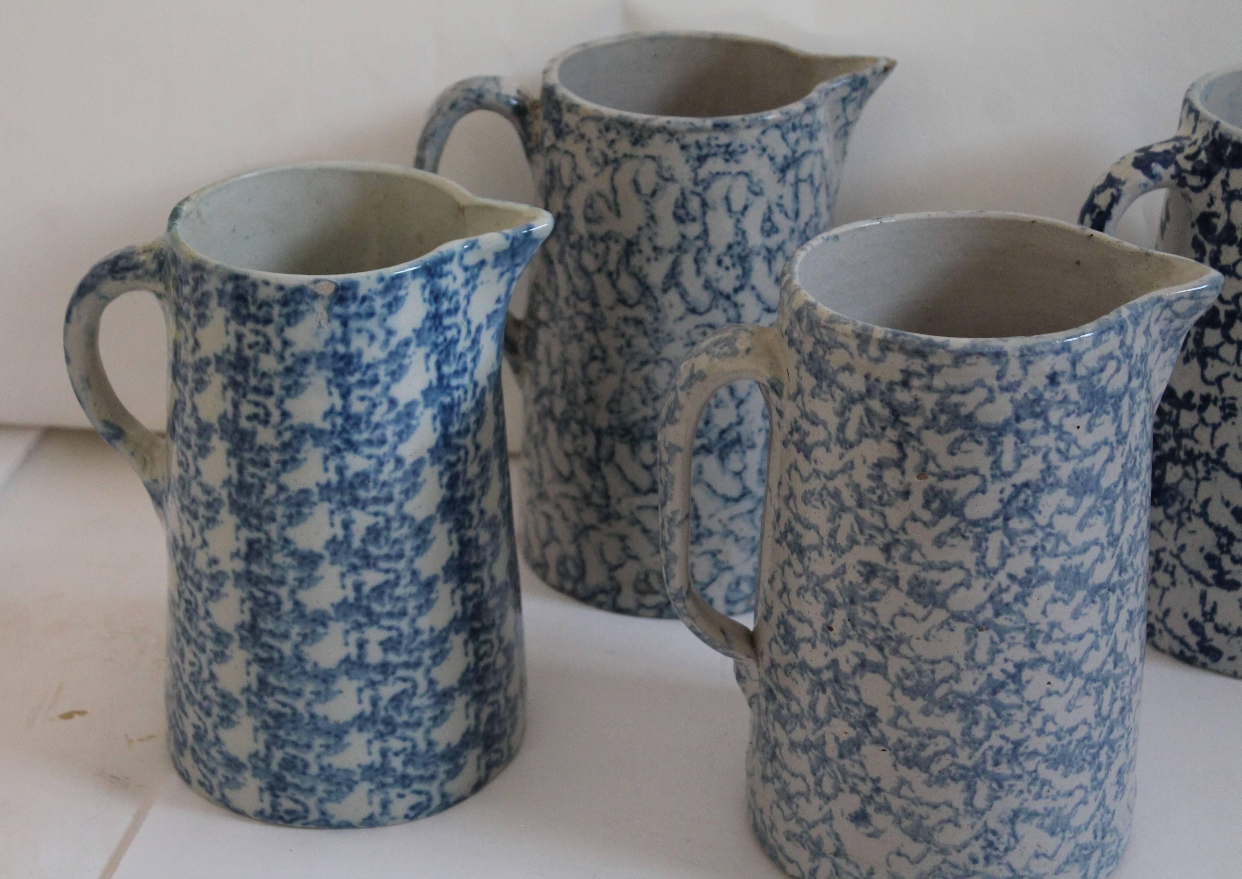 This collection of 19th century spongeware pottery. These blue and white patterned stone ware pitchers are in good condition with minor chip on lip and base of one. No cracks or other damages. Great collection.