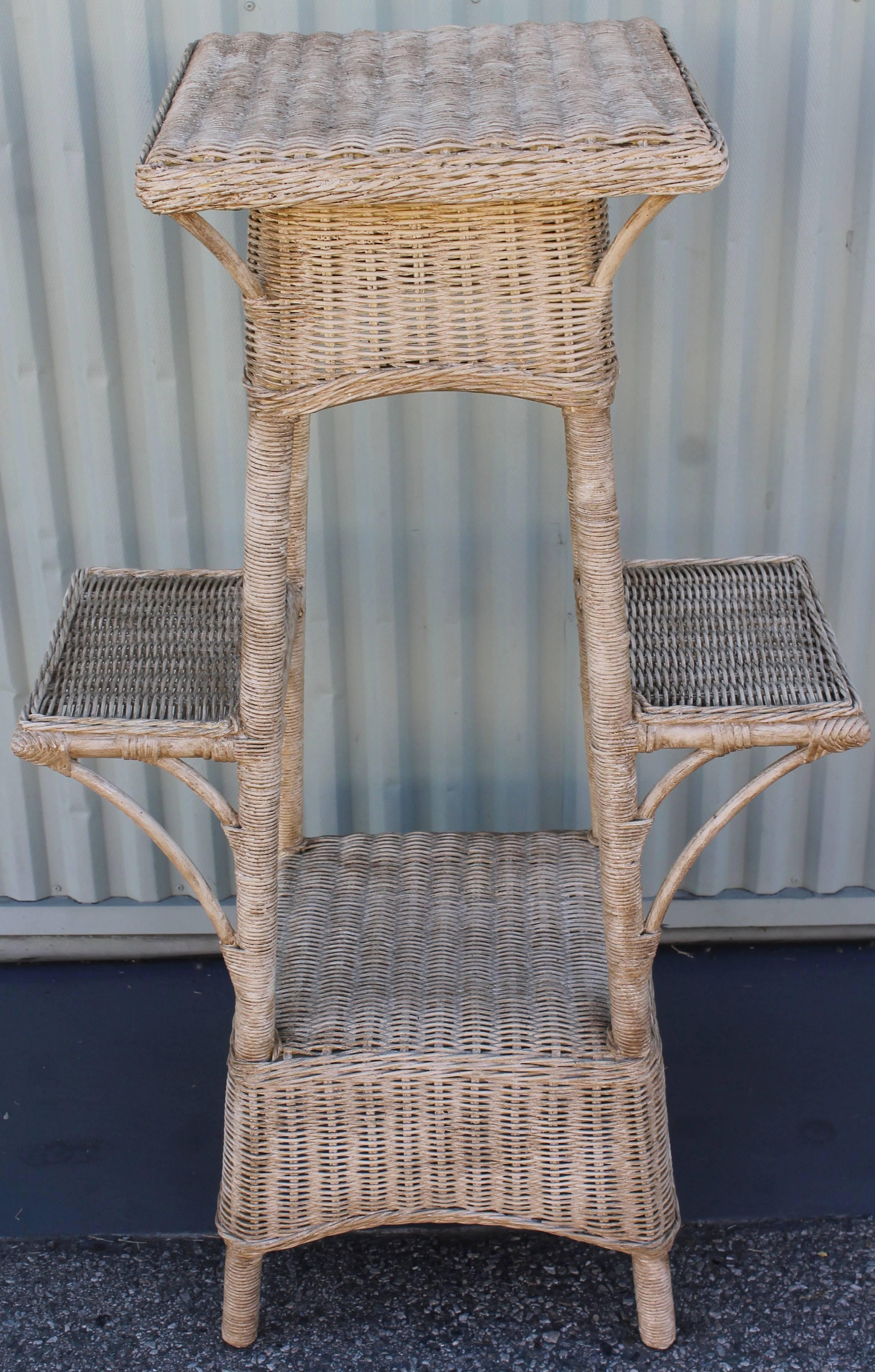 Original painted wicker plant stand from New England. The condition is very good and sturdy.