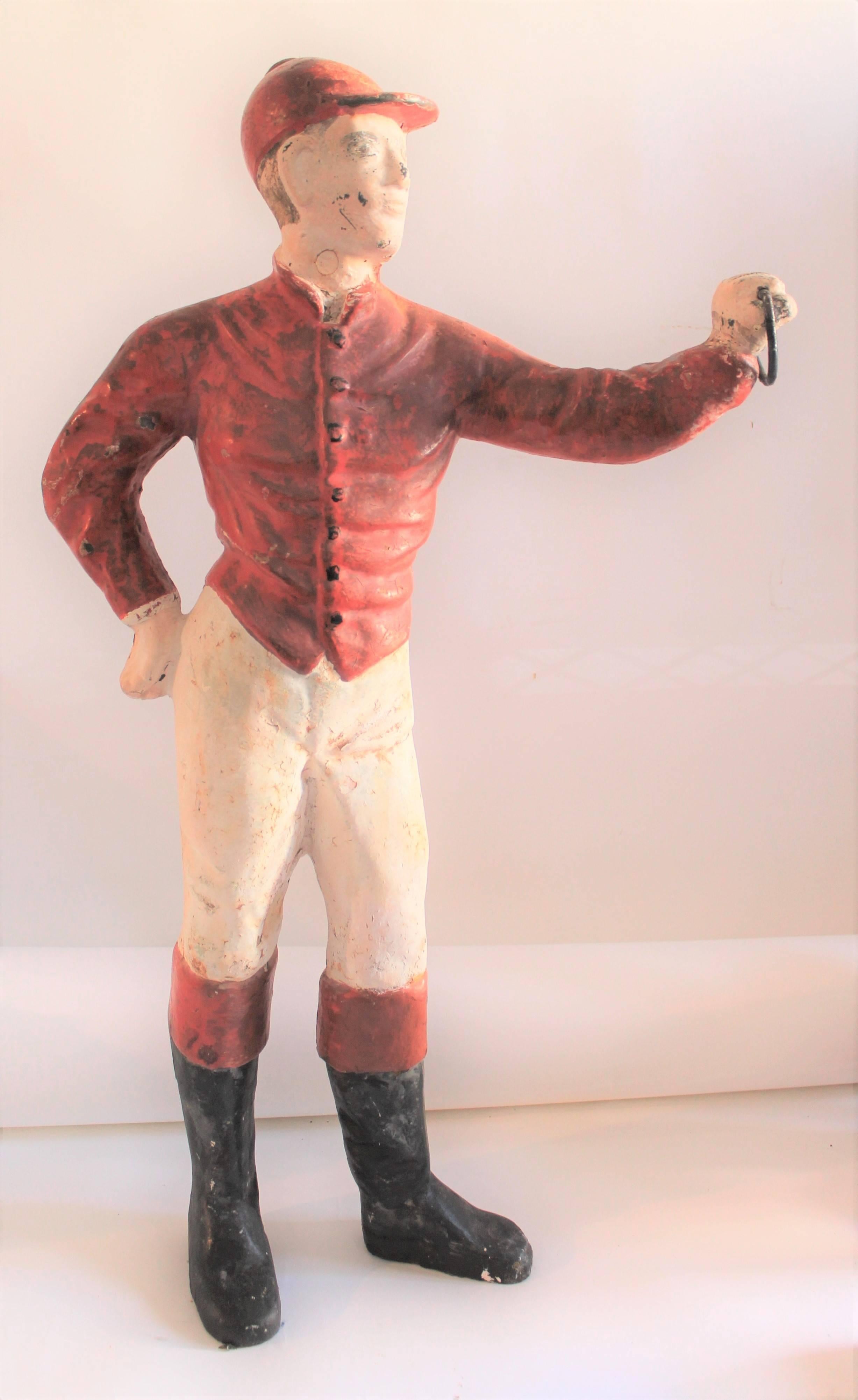 19th century jockey that has been over painted. With ring for the hitching post. In fine as found condition.