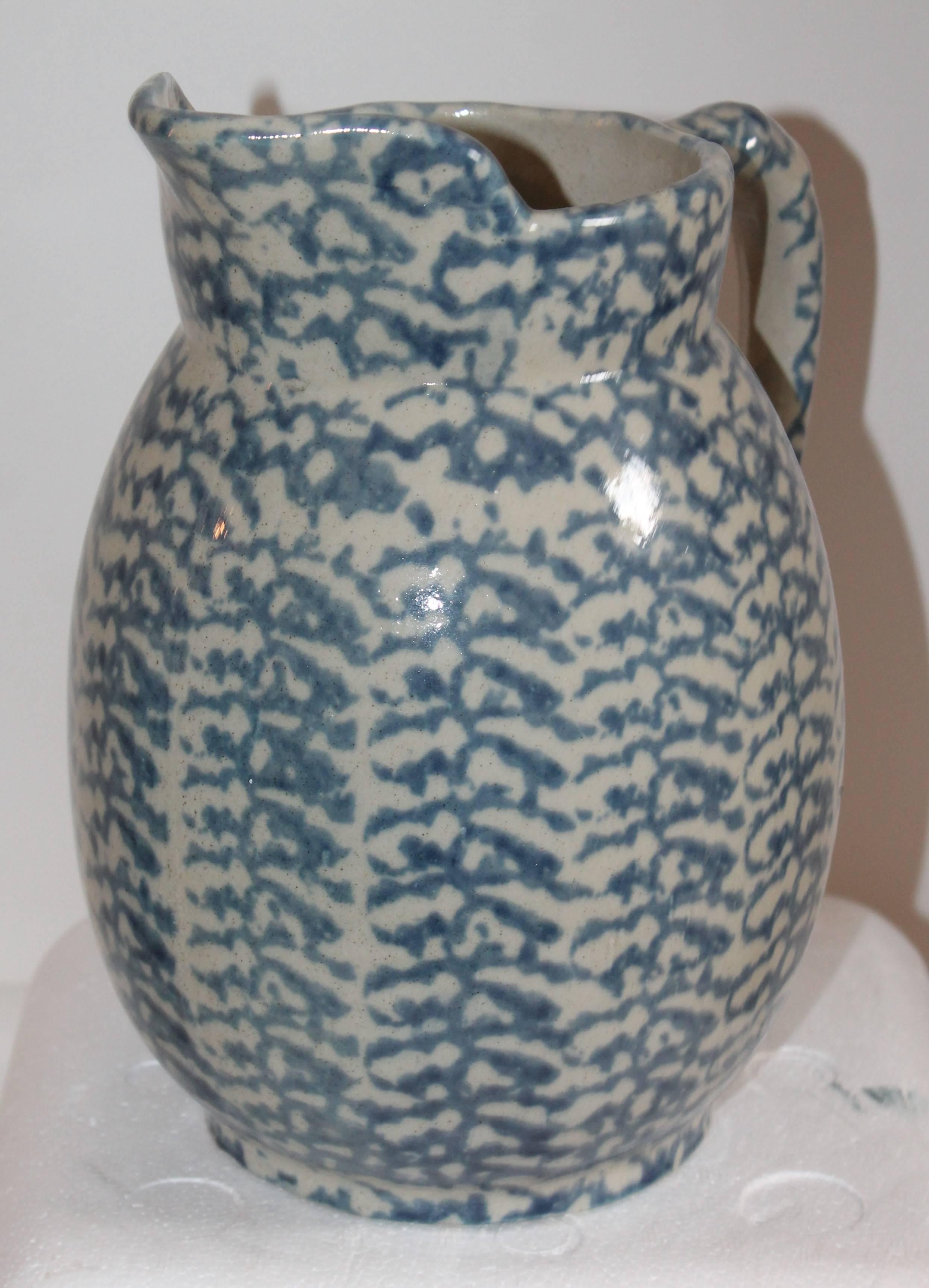 This sponge ware pitcher is most unusual and in very good condition. The surface is more like a salt glaze finish.