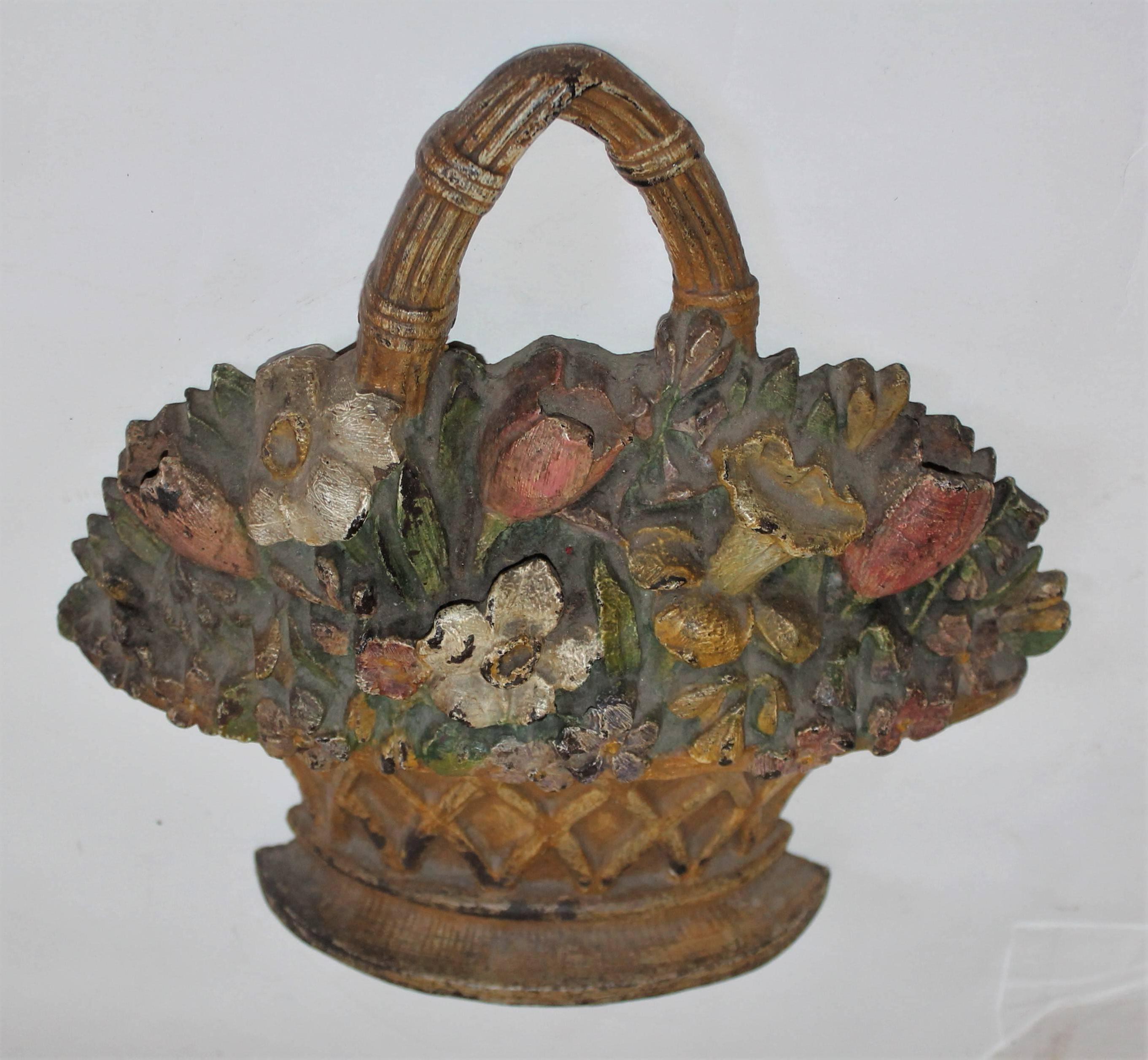 19th century original painted Hubley cast iron doorstop is in fine condition and has a great patina. This is a large floral doorstop with heavy weight.