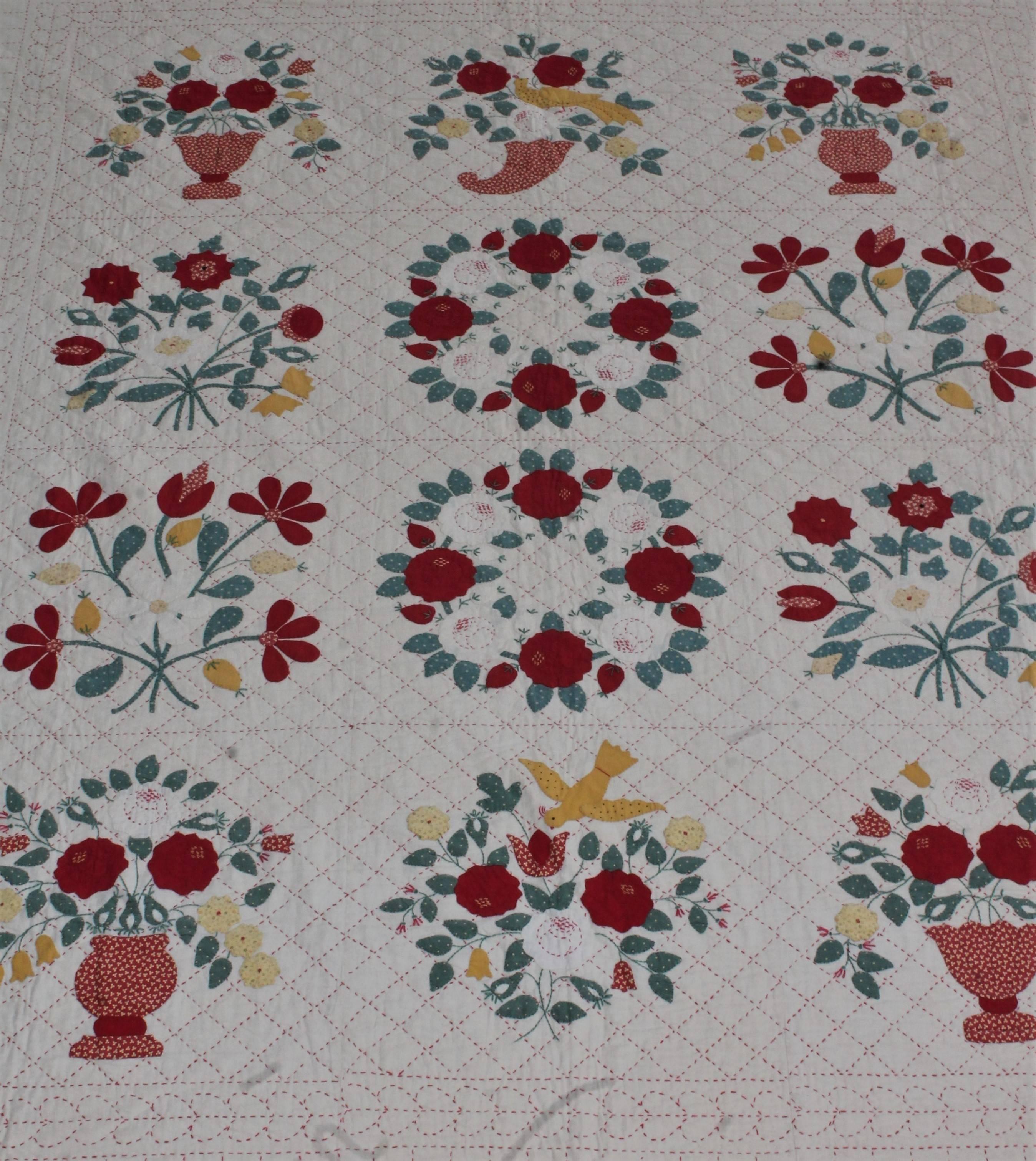 Beautifully executed all hand stitched applique and finely stitched Album quilt. This quilt is unusually quilted in red threading instead of white. This makes it much more visible to see the heavy quilting detail.