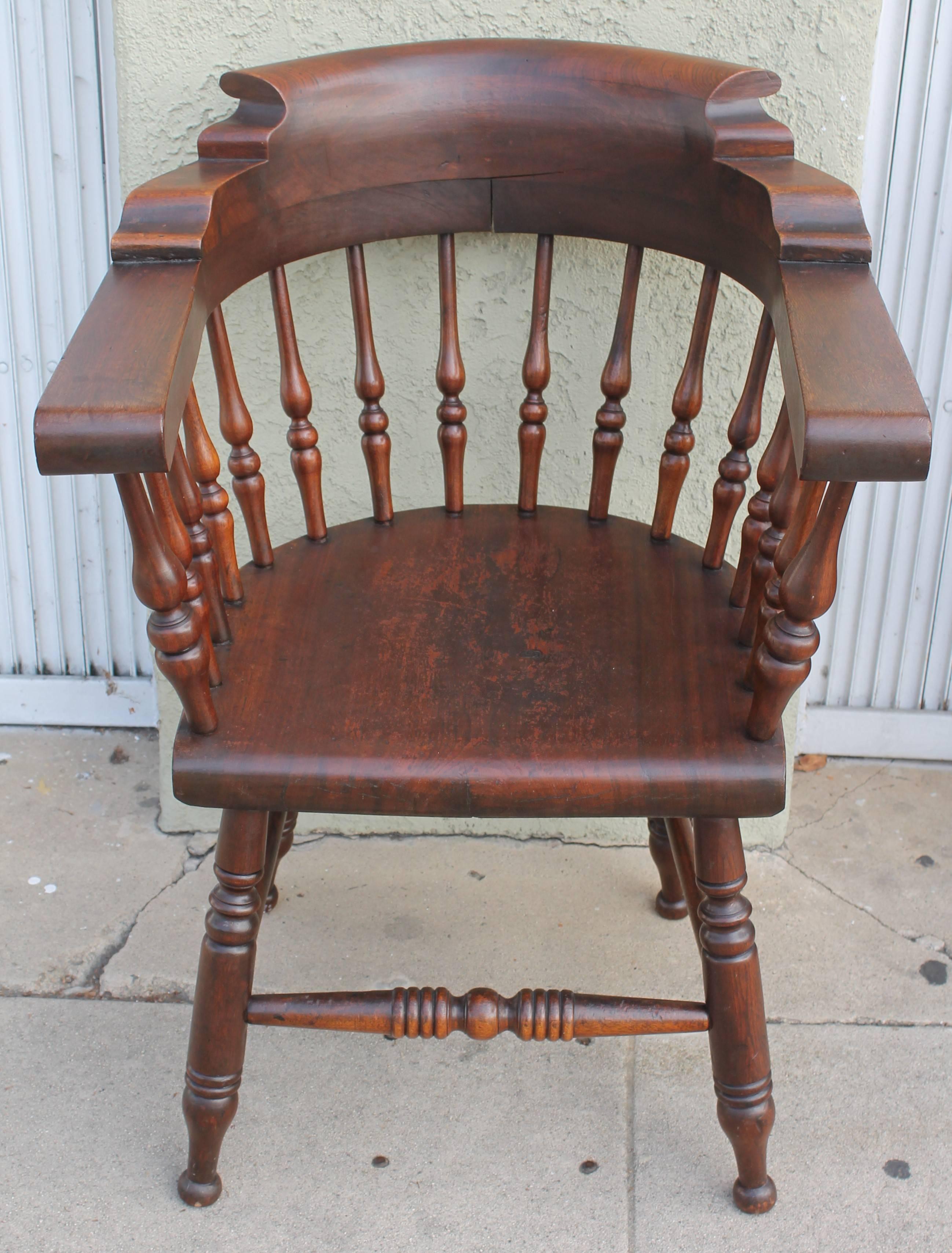 This wonderful matching set of four walnut captains chairs are from the state of Maine and in pristine, sturdy condition. The surface is all original with a mellow worn patina. These chairs have never been refinished and retain the original old