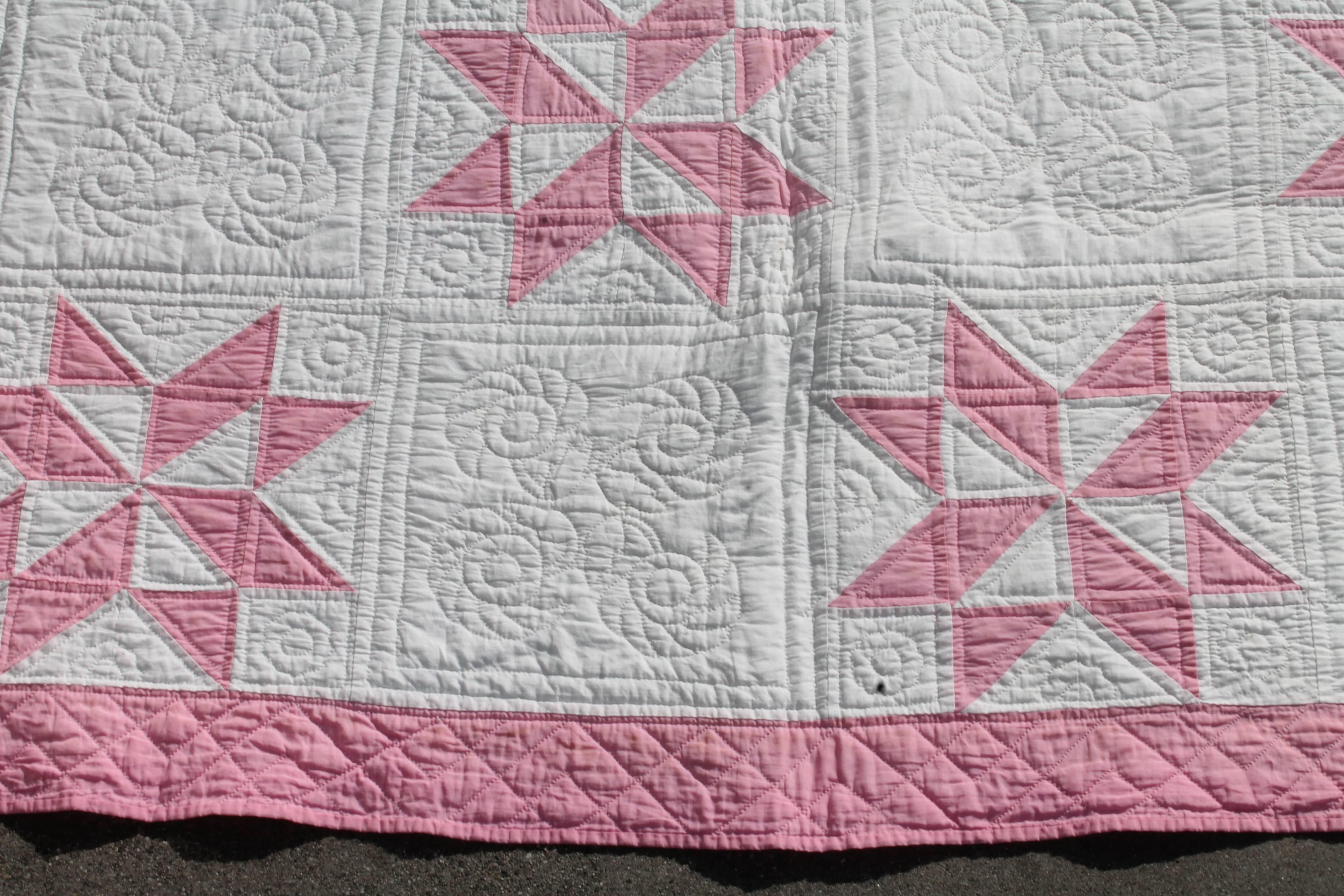 This early 19th century dusty rose eight point stars quilt is in fine condition and is loaded with cotton seeds. The quilting is very fine as well as the piece work too.