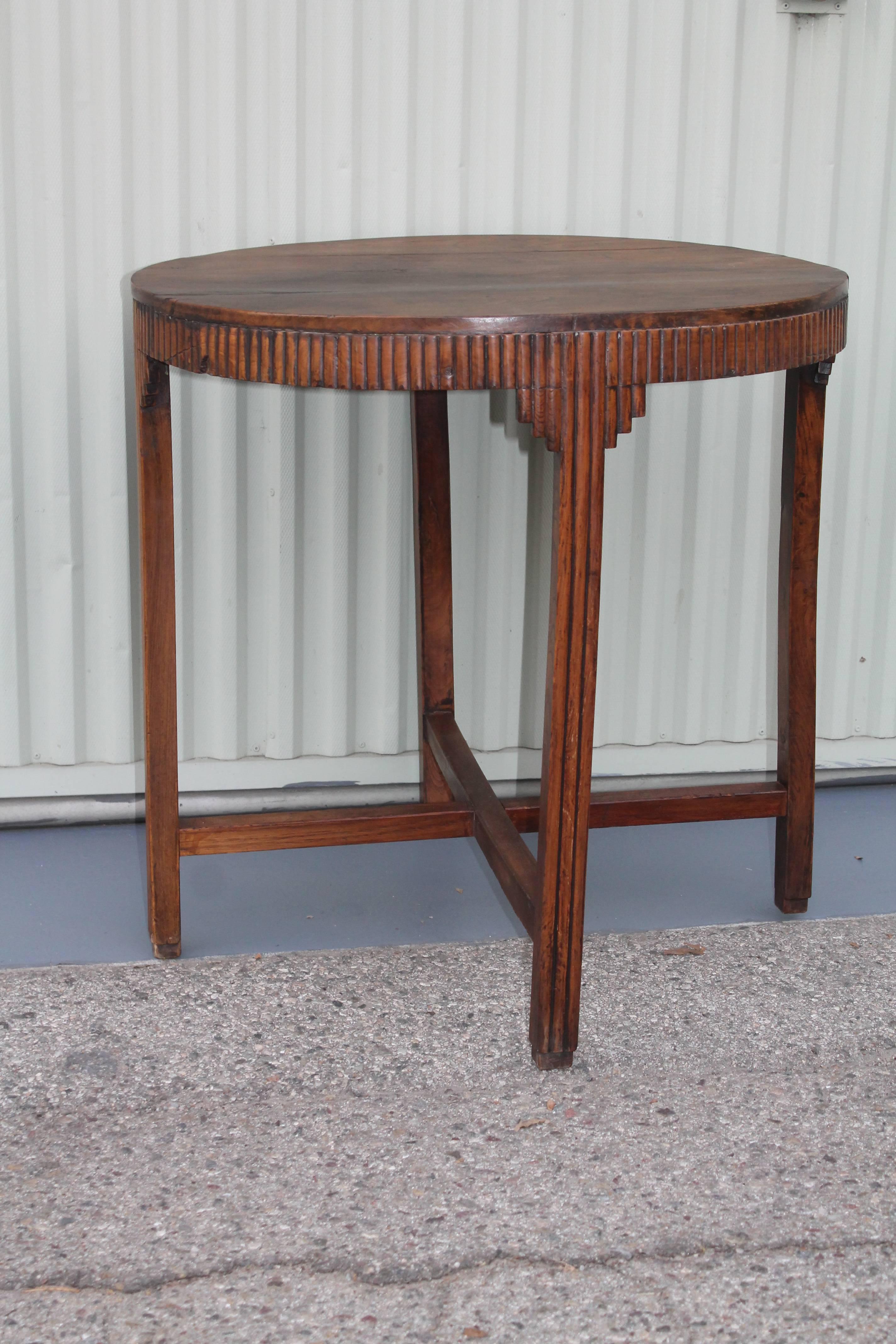 This fine handmade side table has a twig like inlaid trim. The condition is good with minor age cracks in areas. It is very sturdy and strong. Great looking side table.