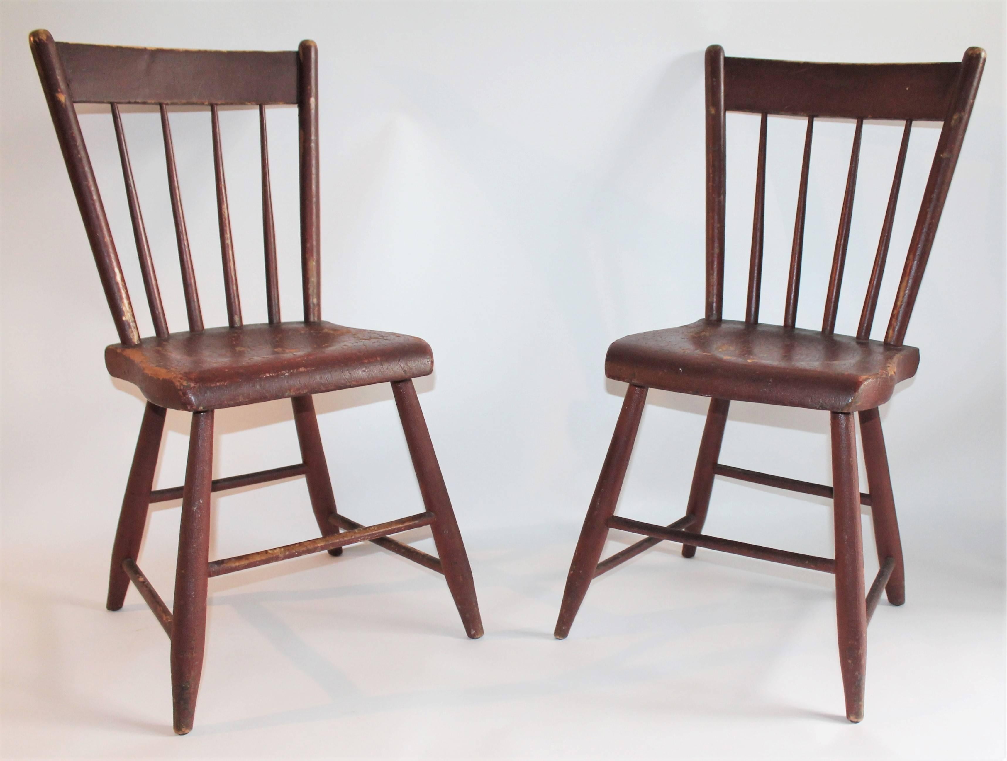 Pair of 19Thc original red painted plank bottom chairs from Pennsylvania. Great side chairs to go with a farm table.