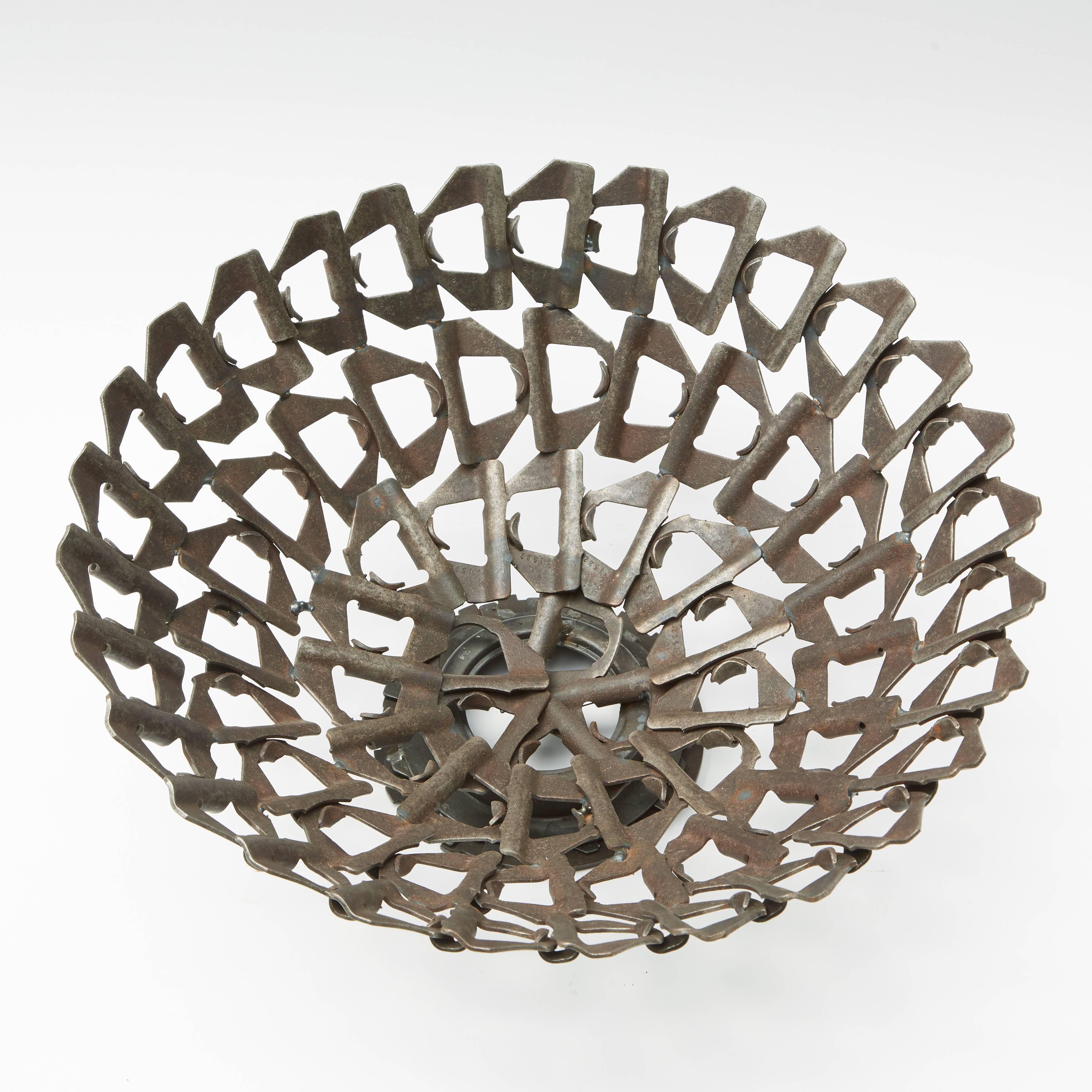 A chain linked Industrial metal bowl.
