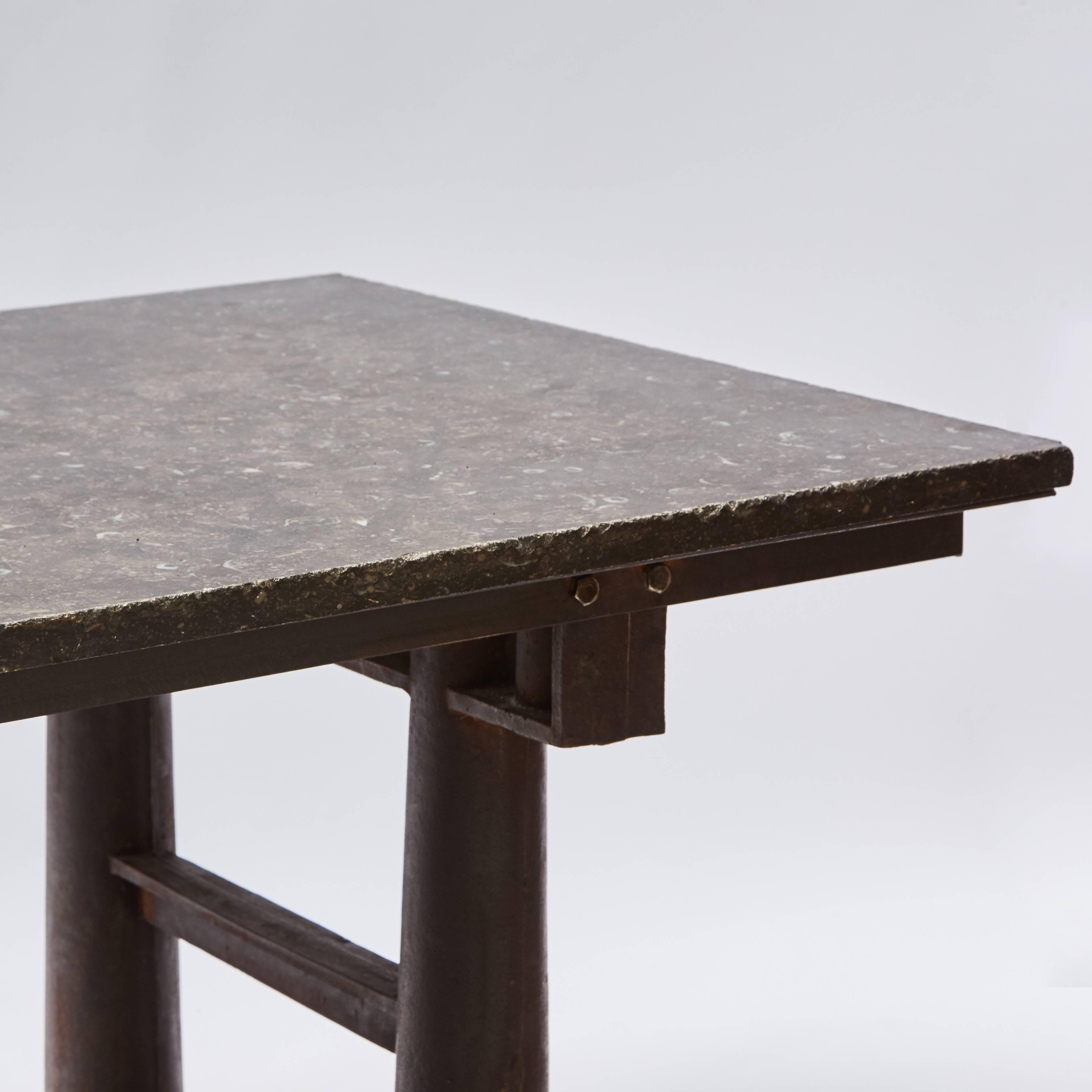 A large Industrial table with Belgian blue stone top.