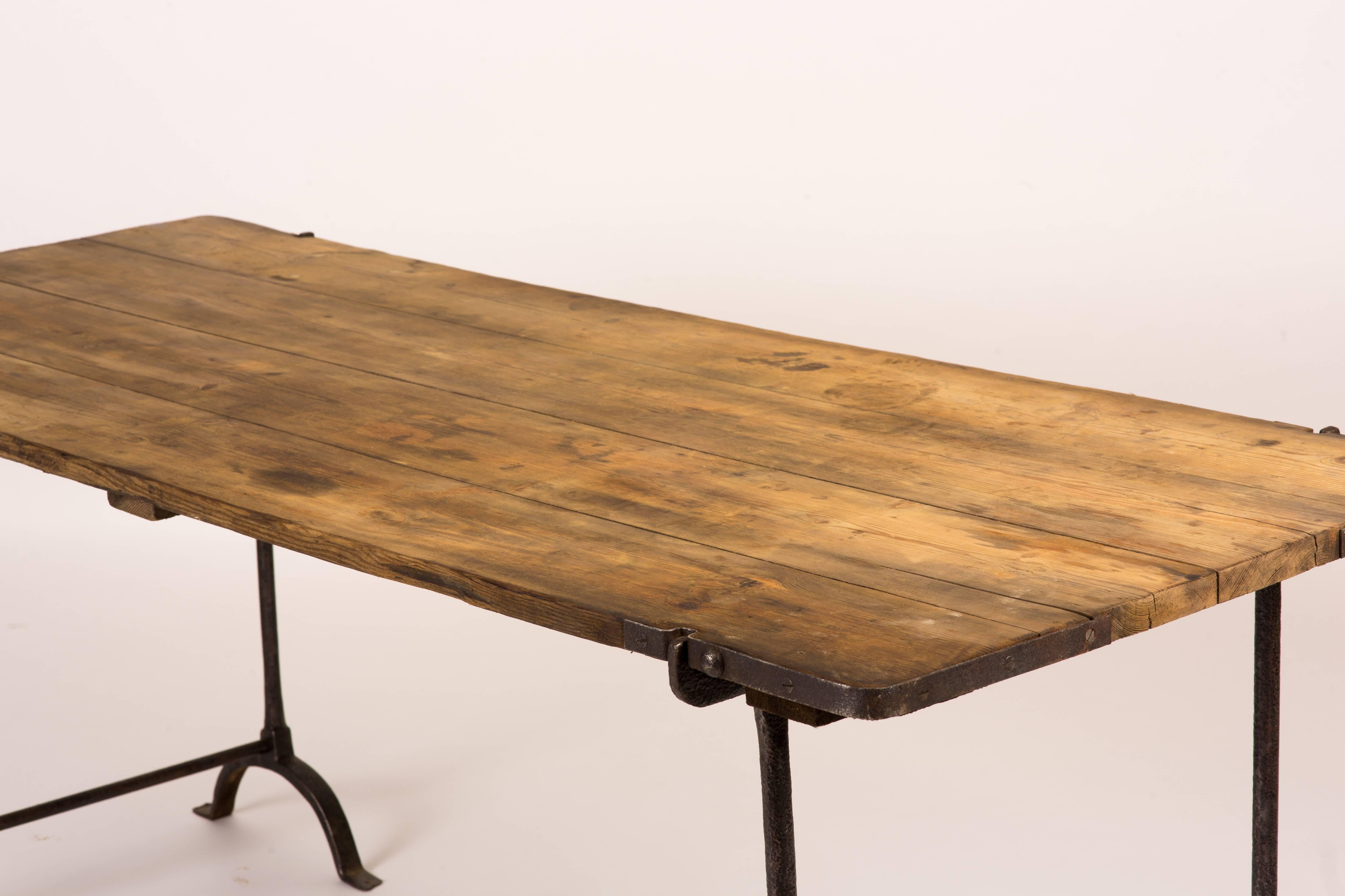 English Trestle Table with Iron Legs and Oakwood Top from England Circa 1850
