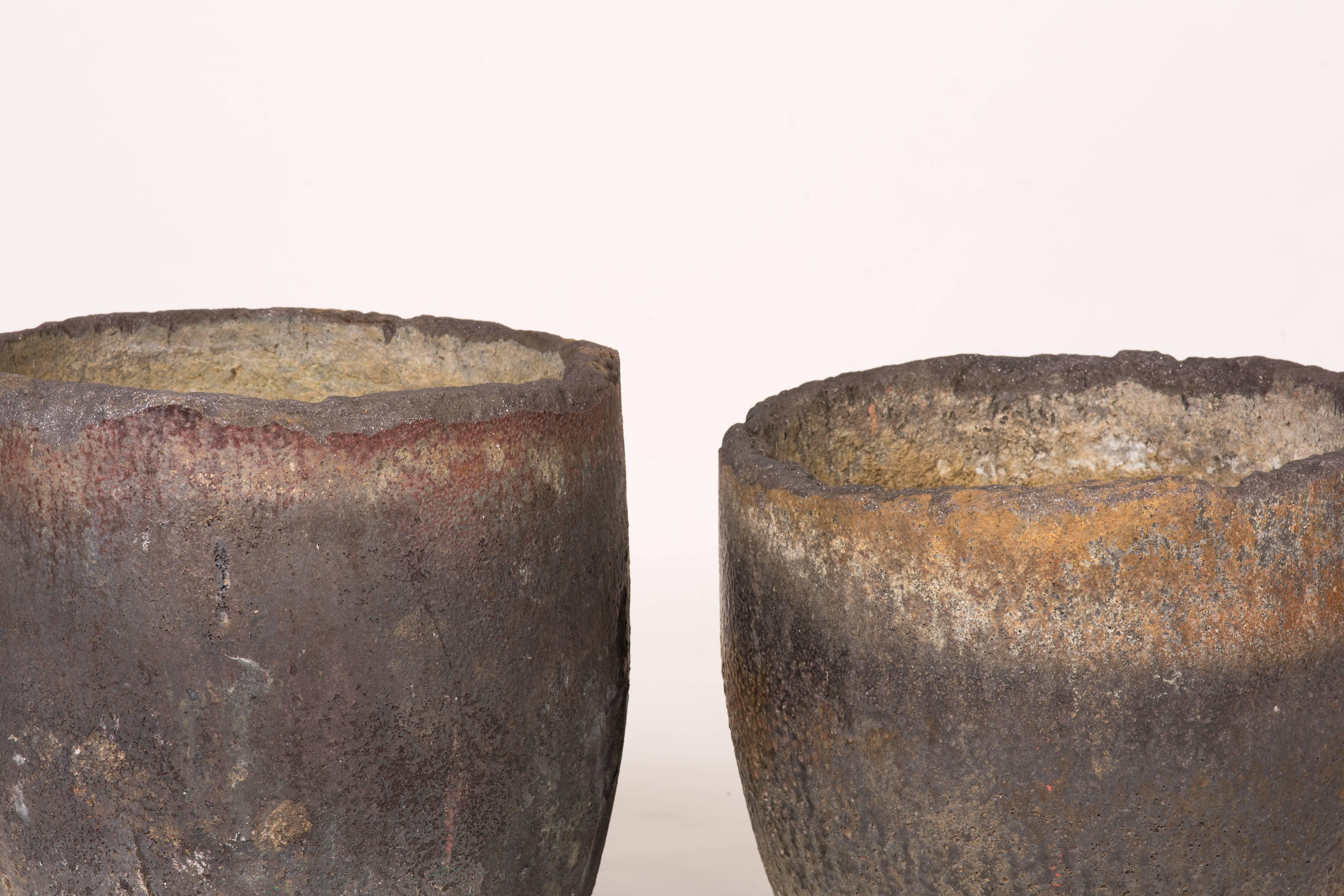 A collection of three lava crucibles used for metal smelting. Great as garden pots or indoor sculptures.
Each vary in height but the depth is the same. 
One: 21