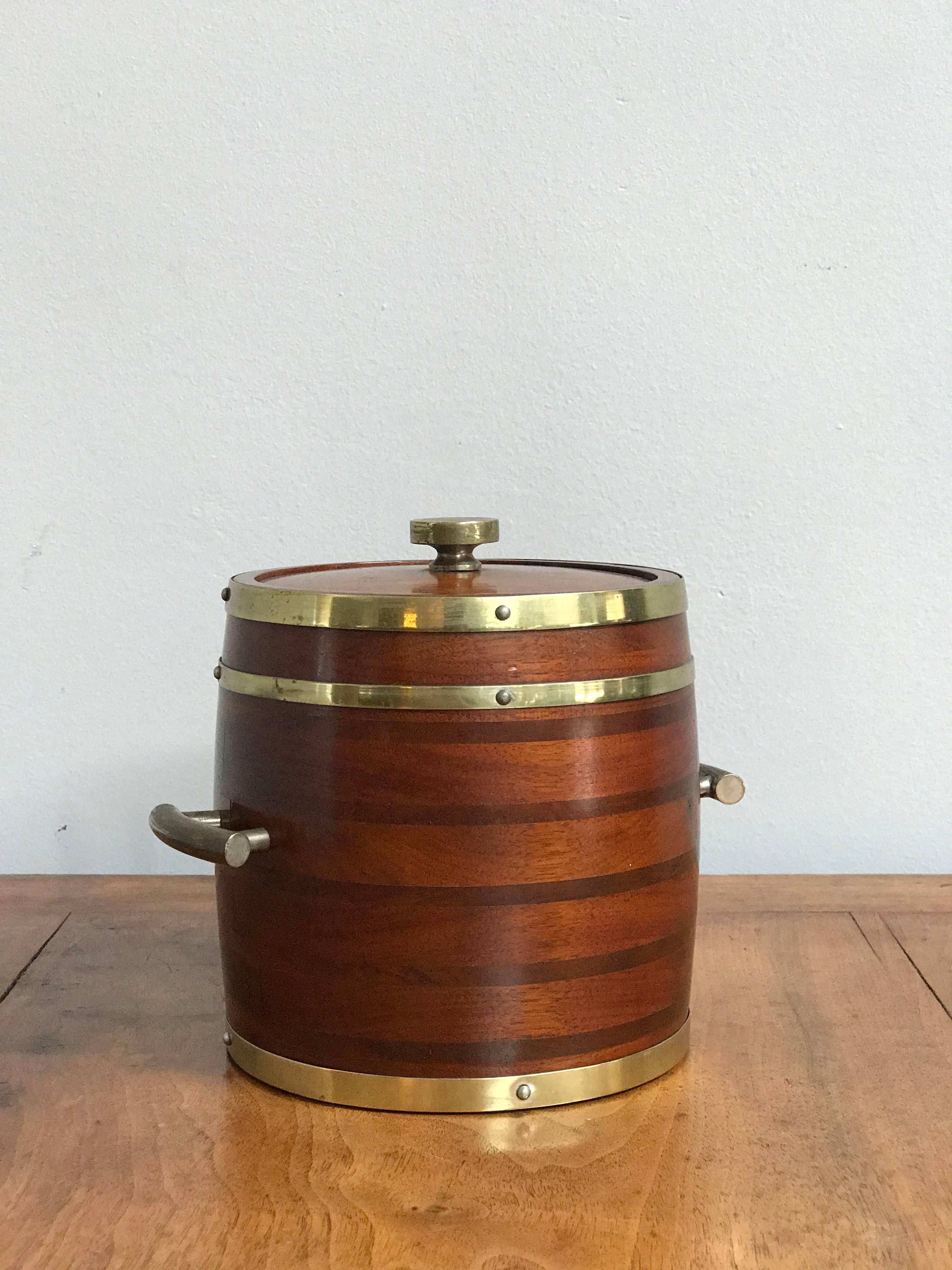 Wooden ice bucket with brass fittings from England circa 1920. 