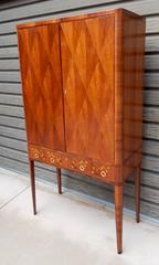 Swedish Storage Cabinet In Walnut with Inlaid Musical Instruments, Circa 1940